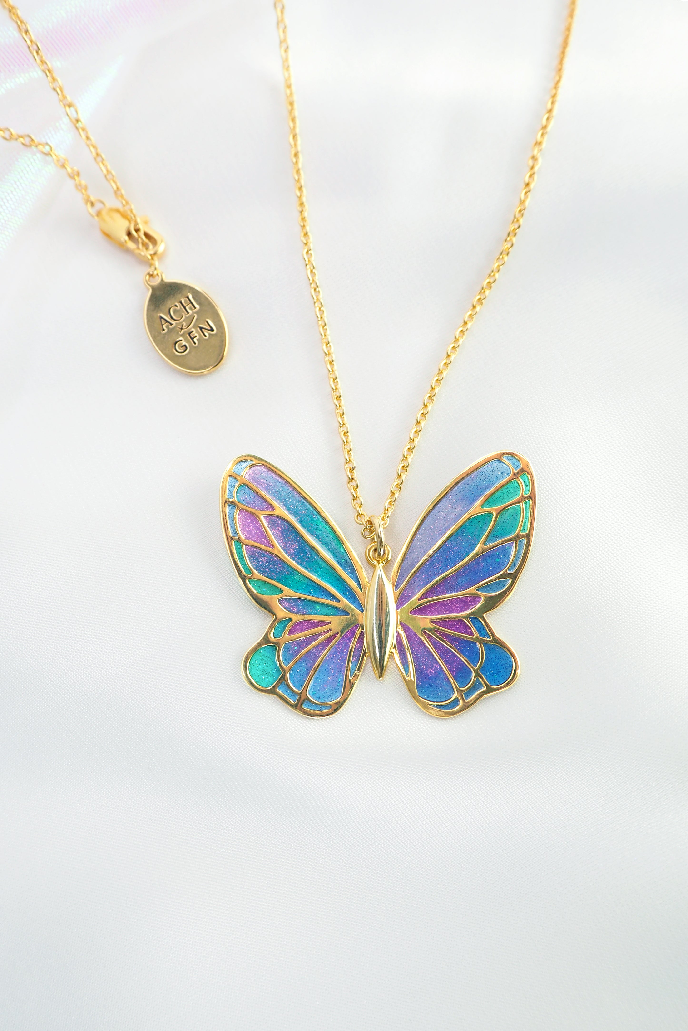 Stunning enamel butterfly necklace featuring vibrant hues and intricate design