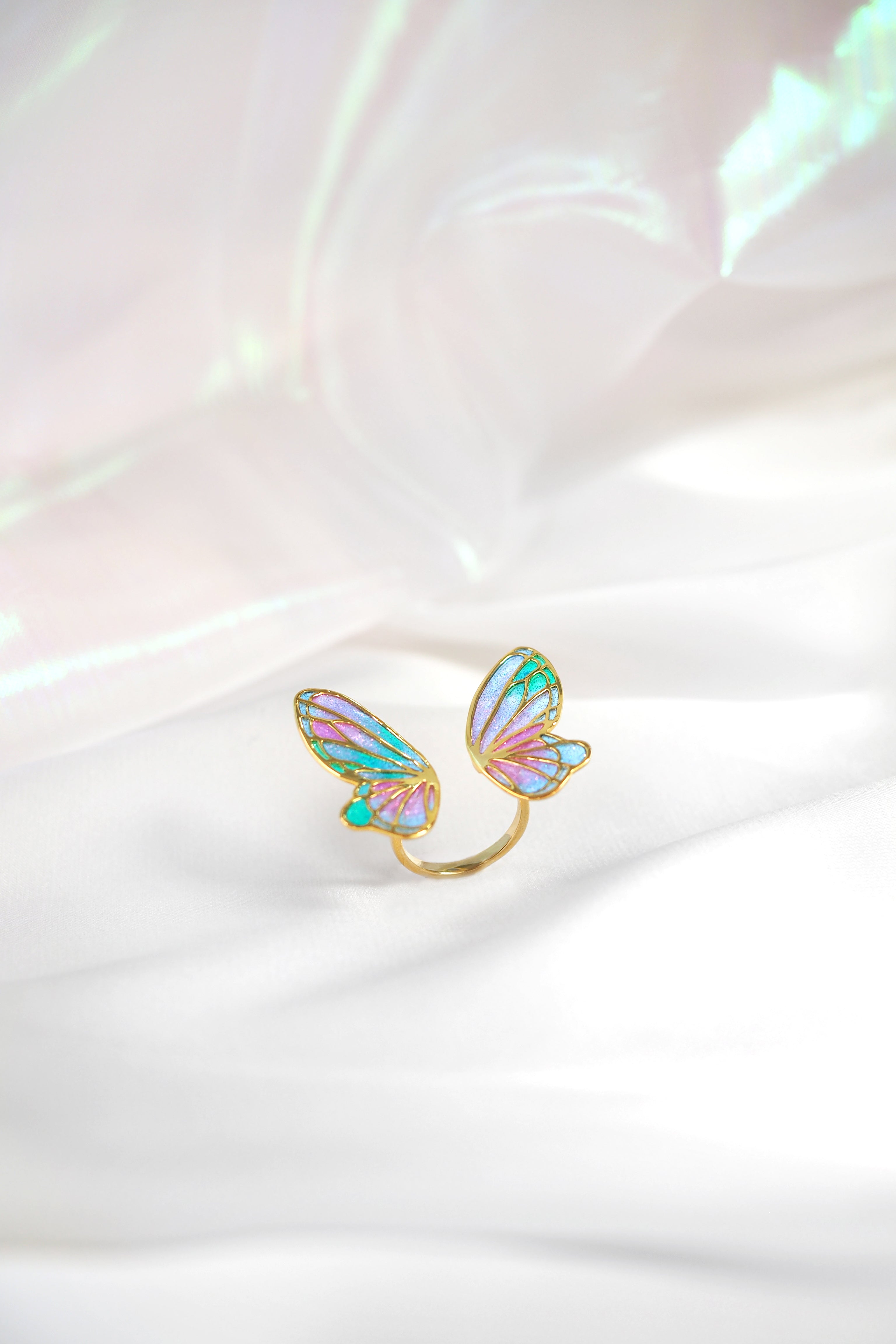 Artistic ring with pastel butterfly wing design