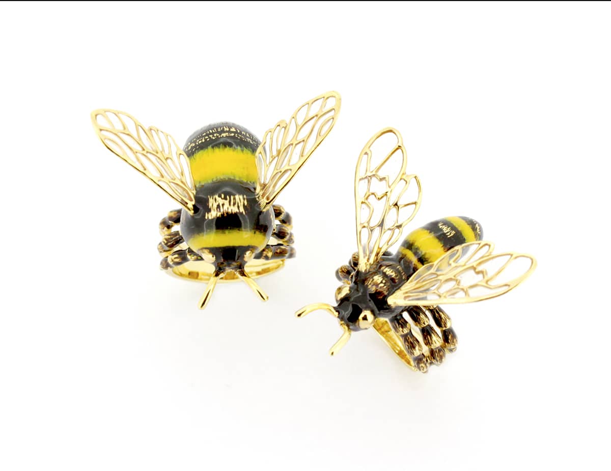 Nature-inspired bee rings showcasing intricate details and vibrant colors.