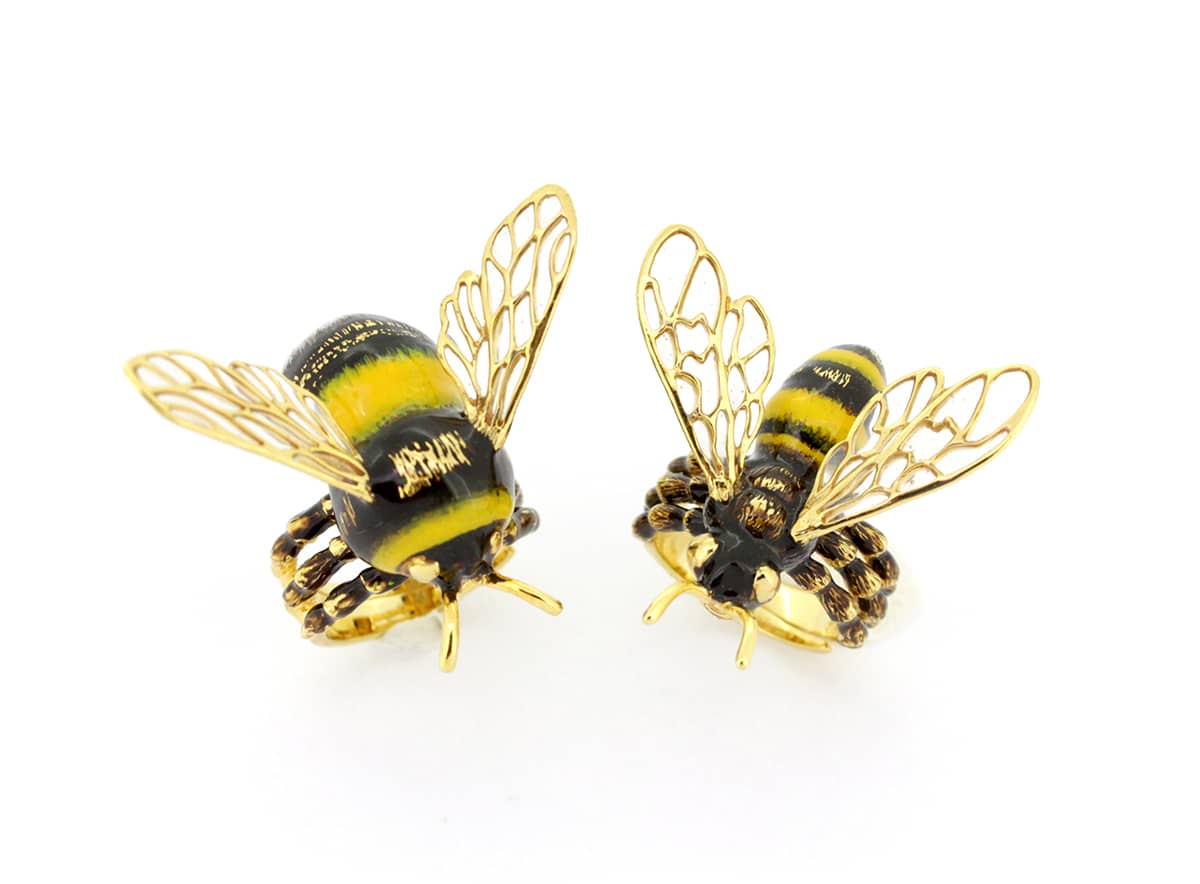 Nature-inspired bee rings showcasing intricate details and vibrant colors.