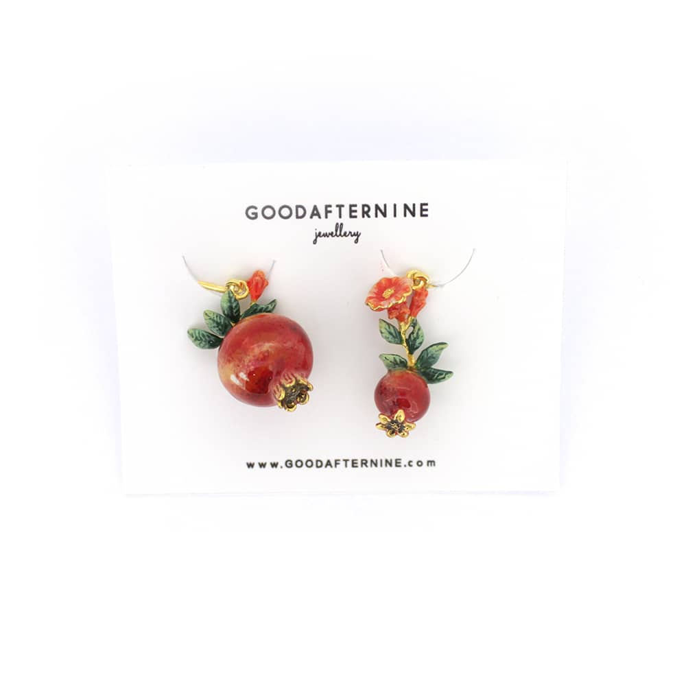 Beautiful red pomegranate earrings adorned with delicate red flowers and green leaves, ideal for summer fashion.