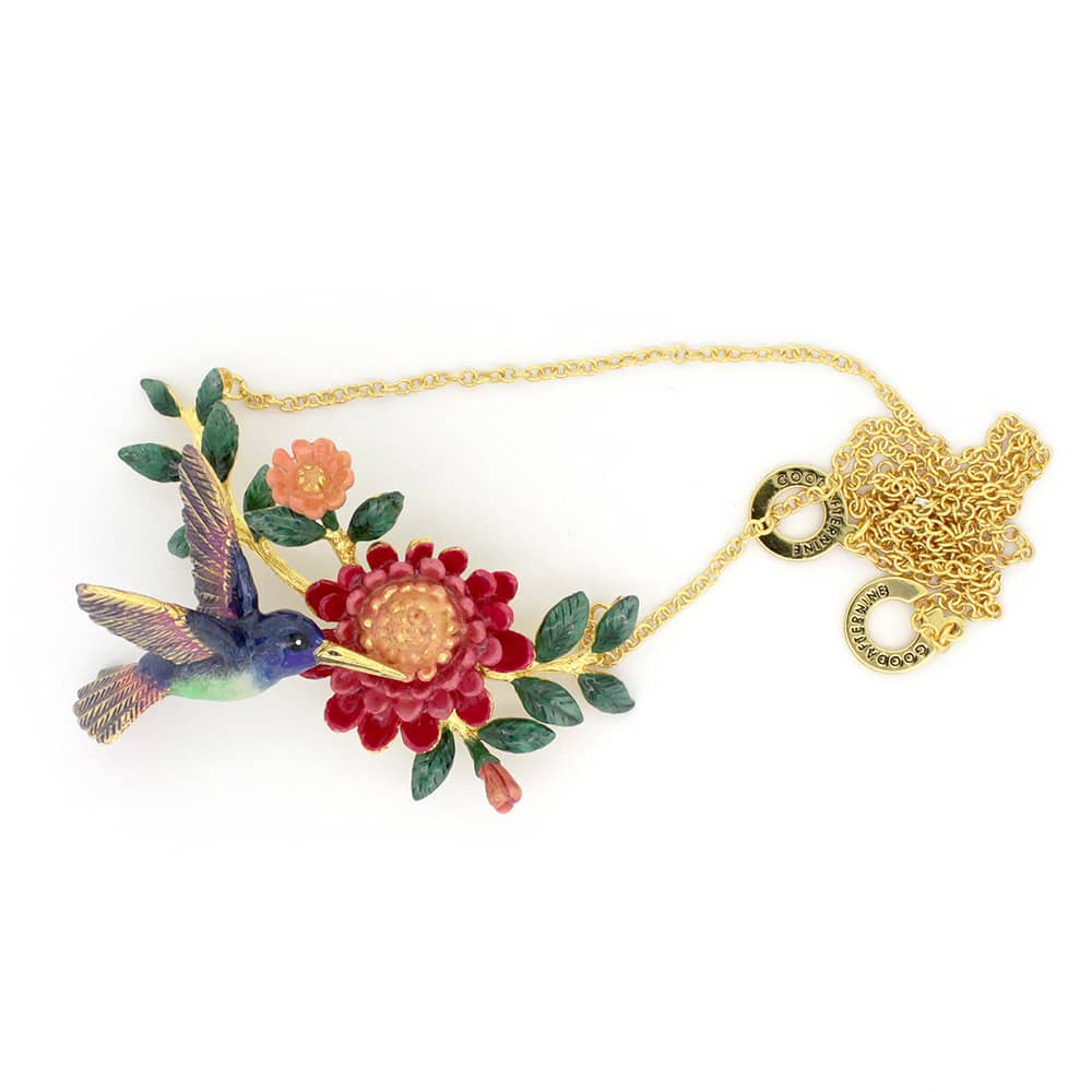 Handcrafted necklace showcasing a hummingbird and floral elements