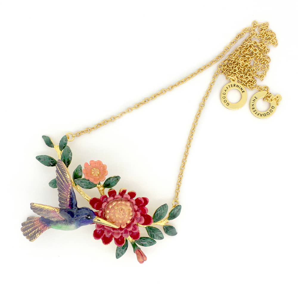 Handcrafted necklace showcasing a hummingbird and floral elements