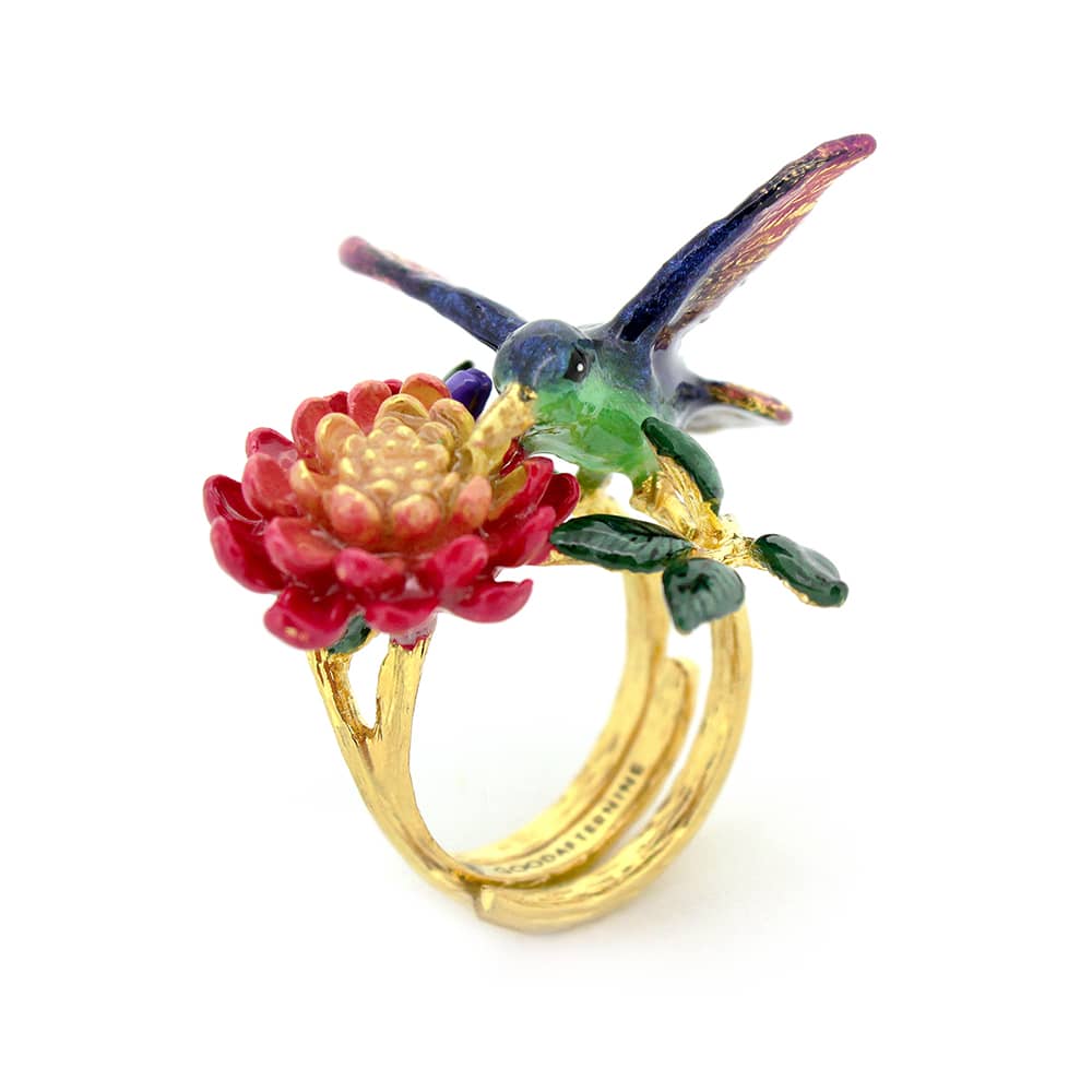 Nature-inspired ring showcasing a hummingbird and blooming flowers