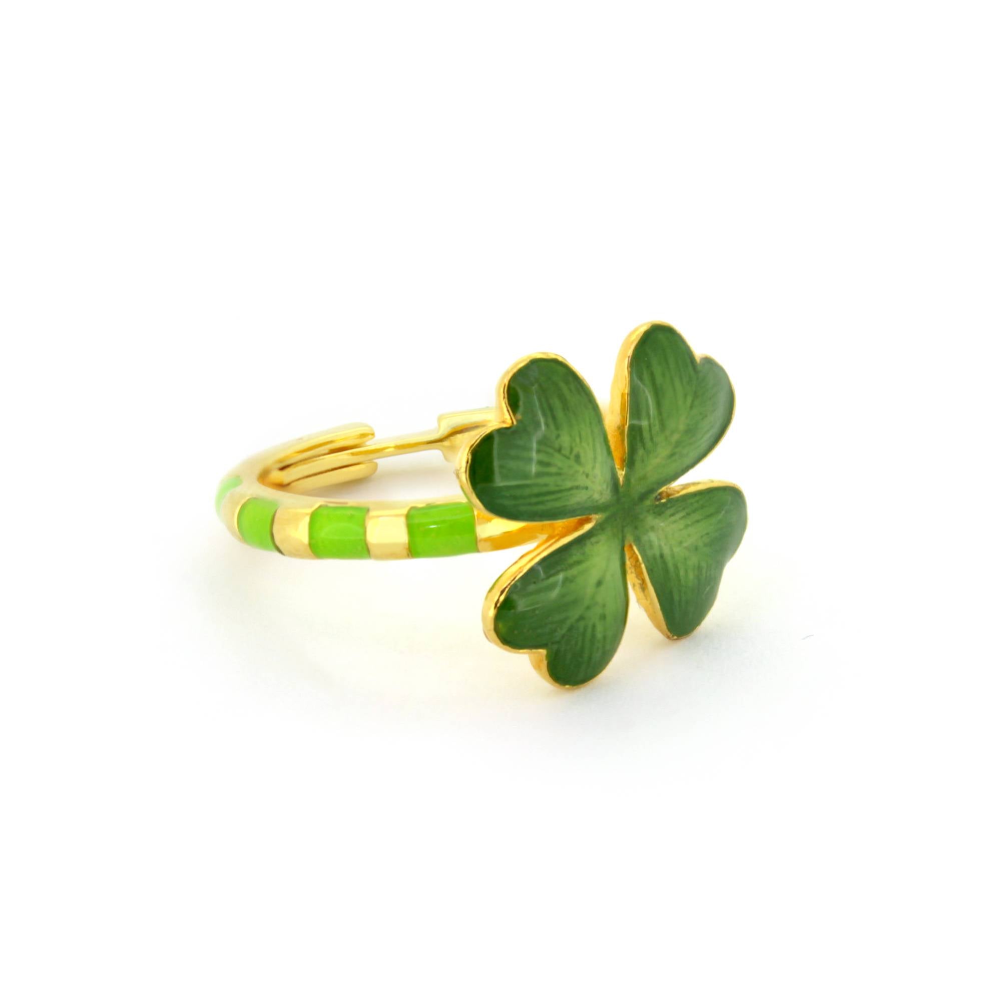 Handmade ring featuring a green four-leaf clover design, with a striped band in green and gold accents.