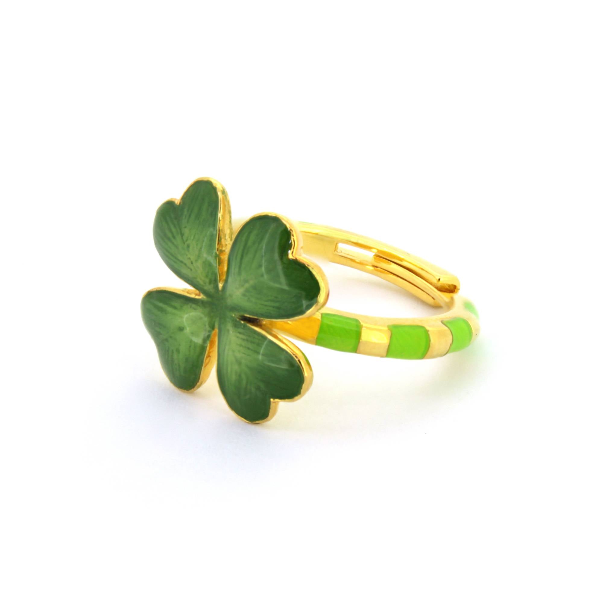 Handmade ring featuring a green four-leaf clover design, with a striped band in green and gold accents.