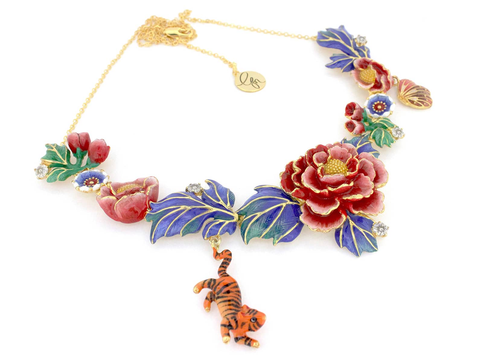 A intricate statement necklace featuring floral designs, red and blue flowers, and a small detailed tiger and butterfly charm.