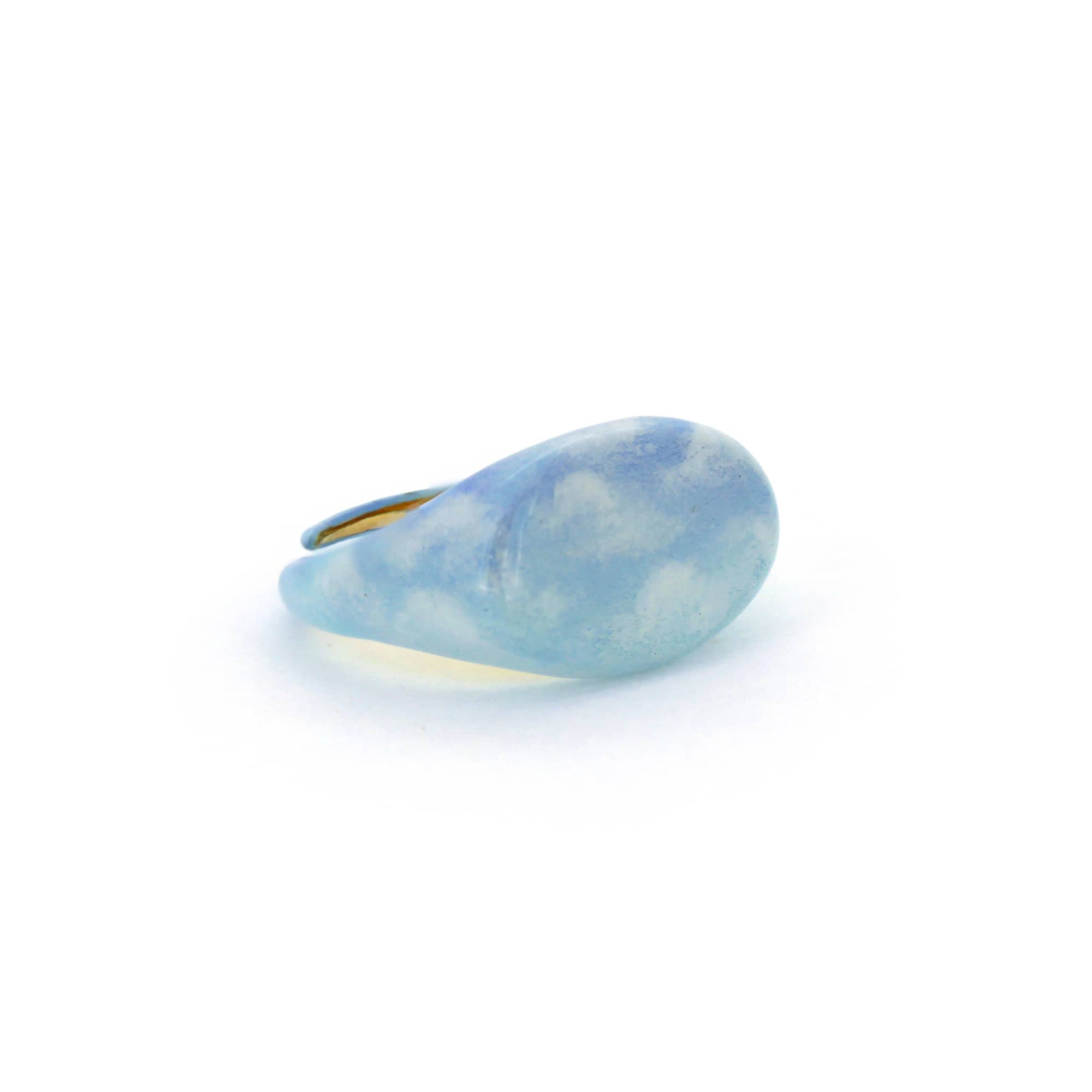 A beautiful hand-painted ring inspired by the sky with soft blue tones.