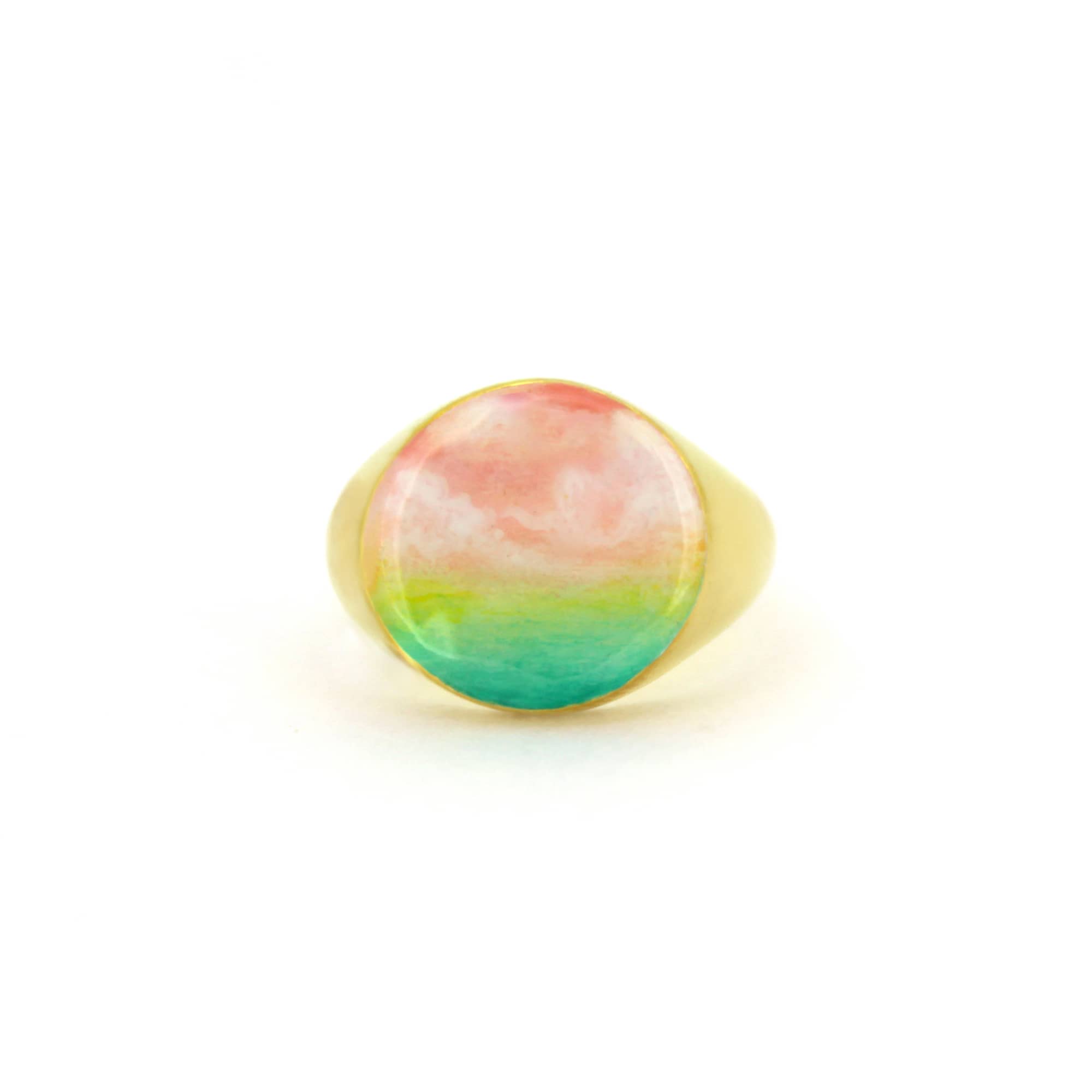 A beautiful hand-painted ring inspired by a colorful dawn with pink and green hues.