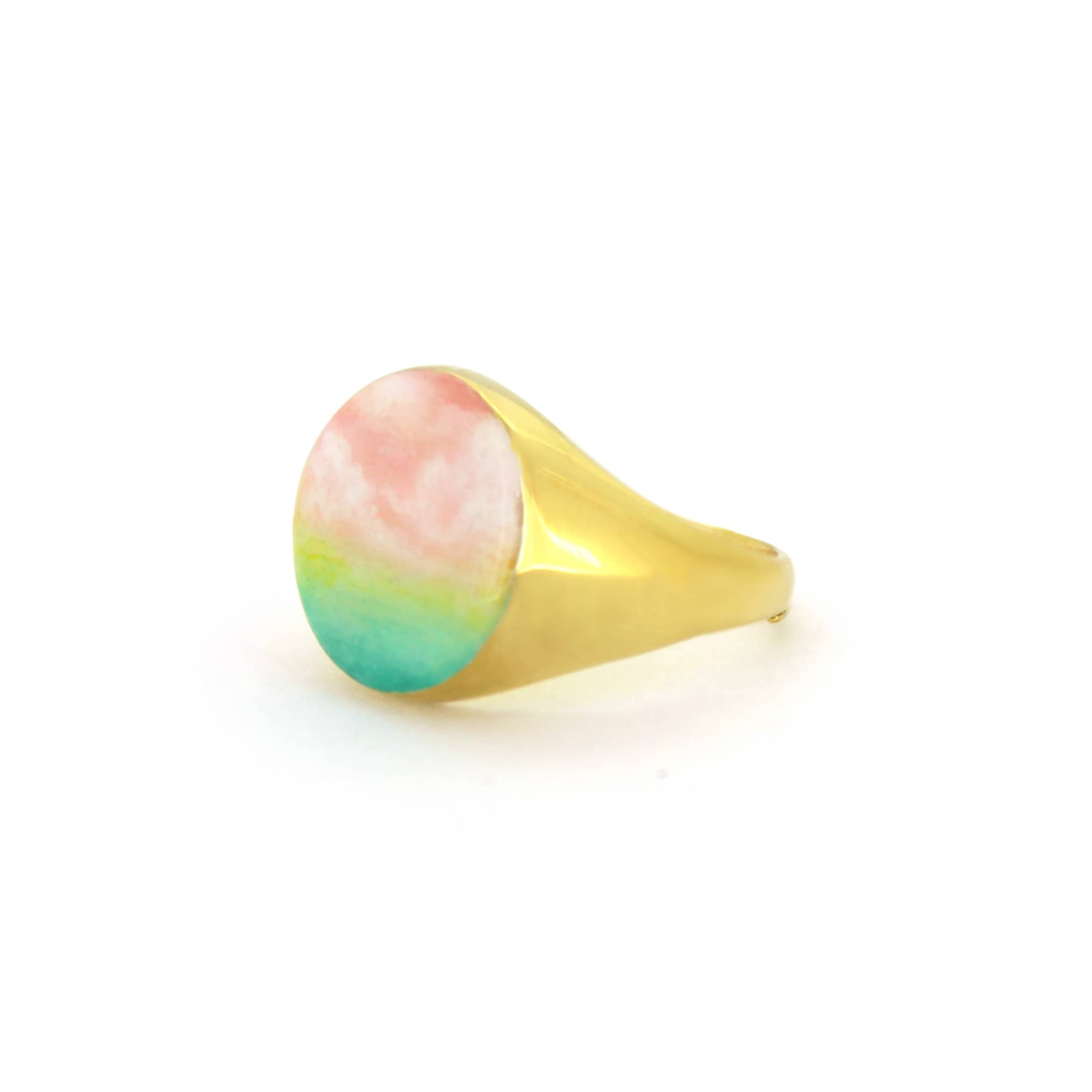 A beautiful hand-painted ring inspired by a colorful dawn with pink and green hues.