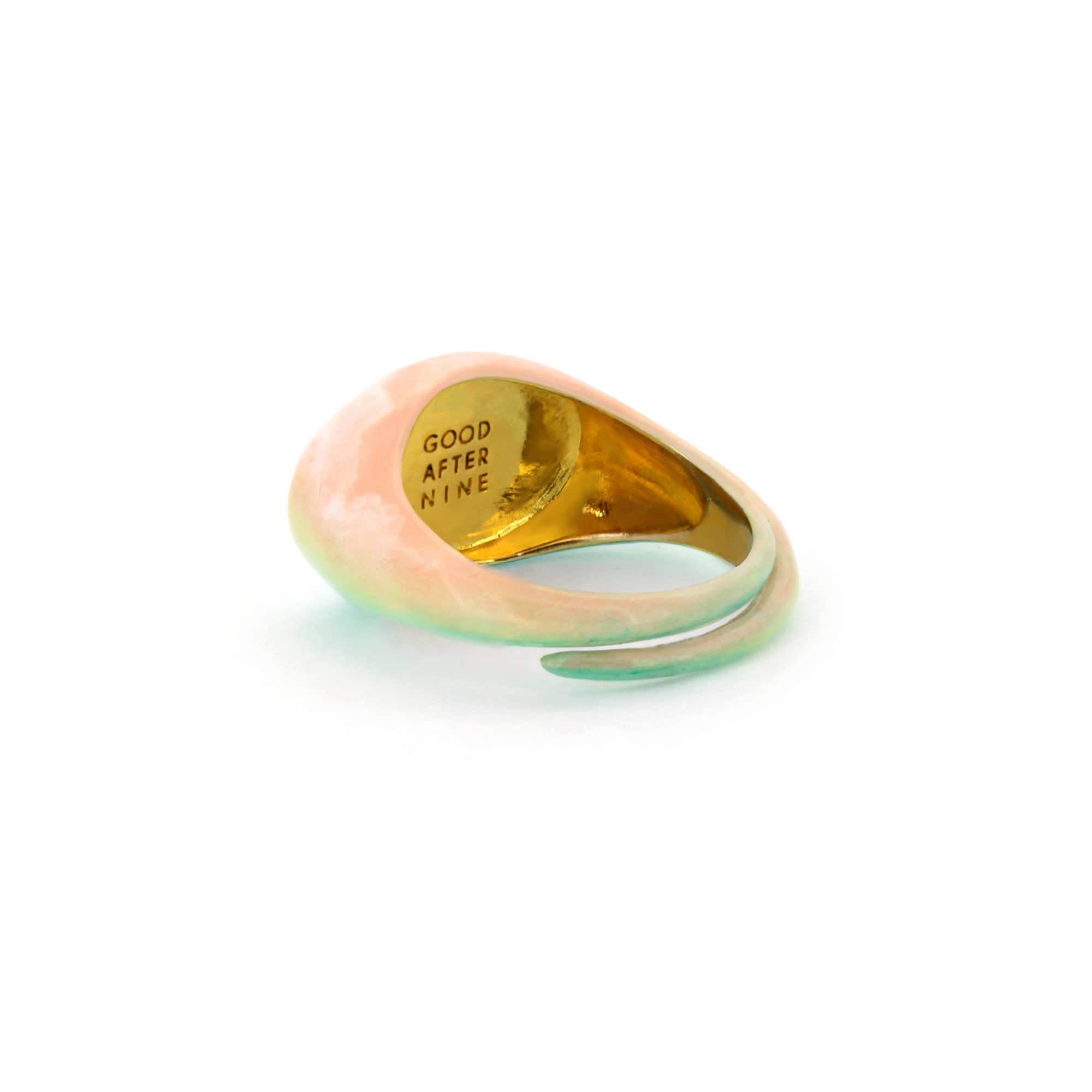 A beautiful hand-painted ring inspired by a colorful dawn with pink and green hues.