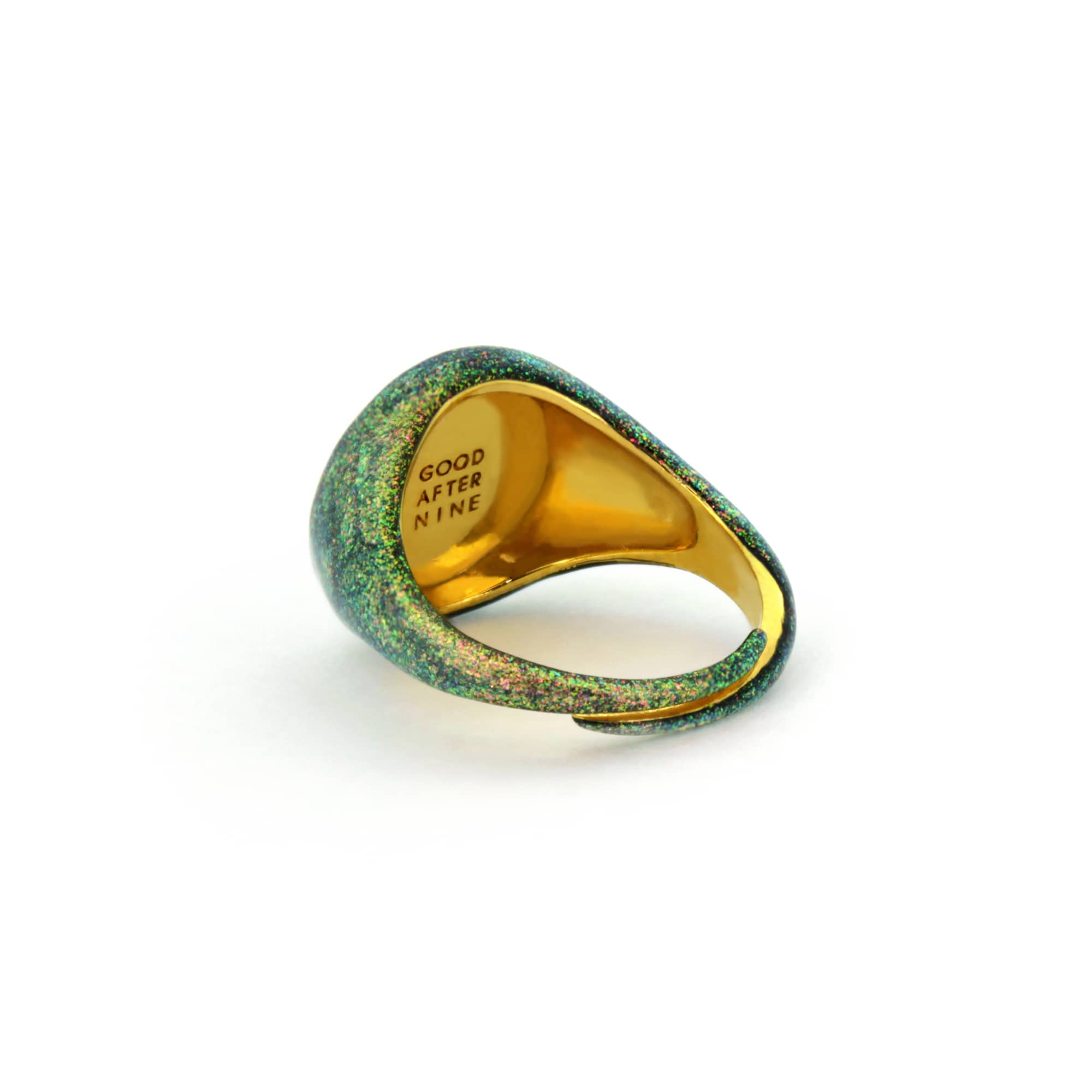 Green and orange shimmering enamel ring inspired by the sky.