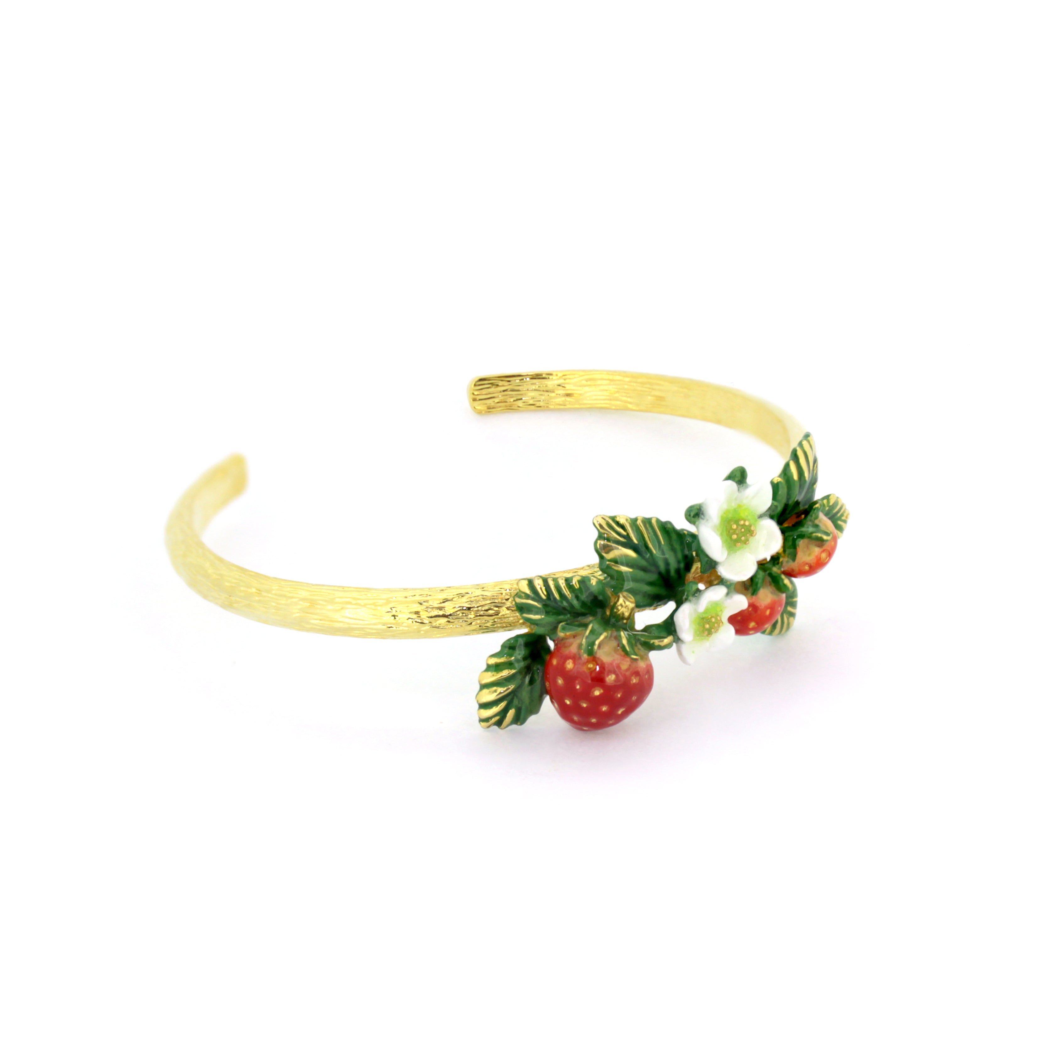 Nature-inspired bangle adorned with red strawberries a white flowers with green leaves.