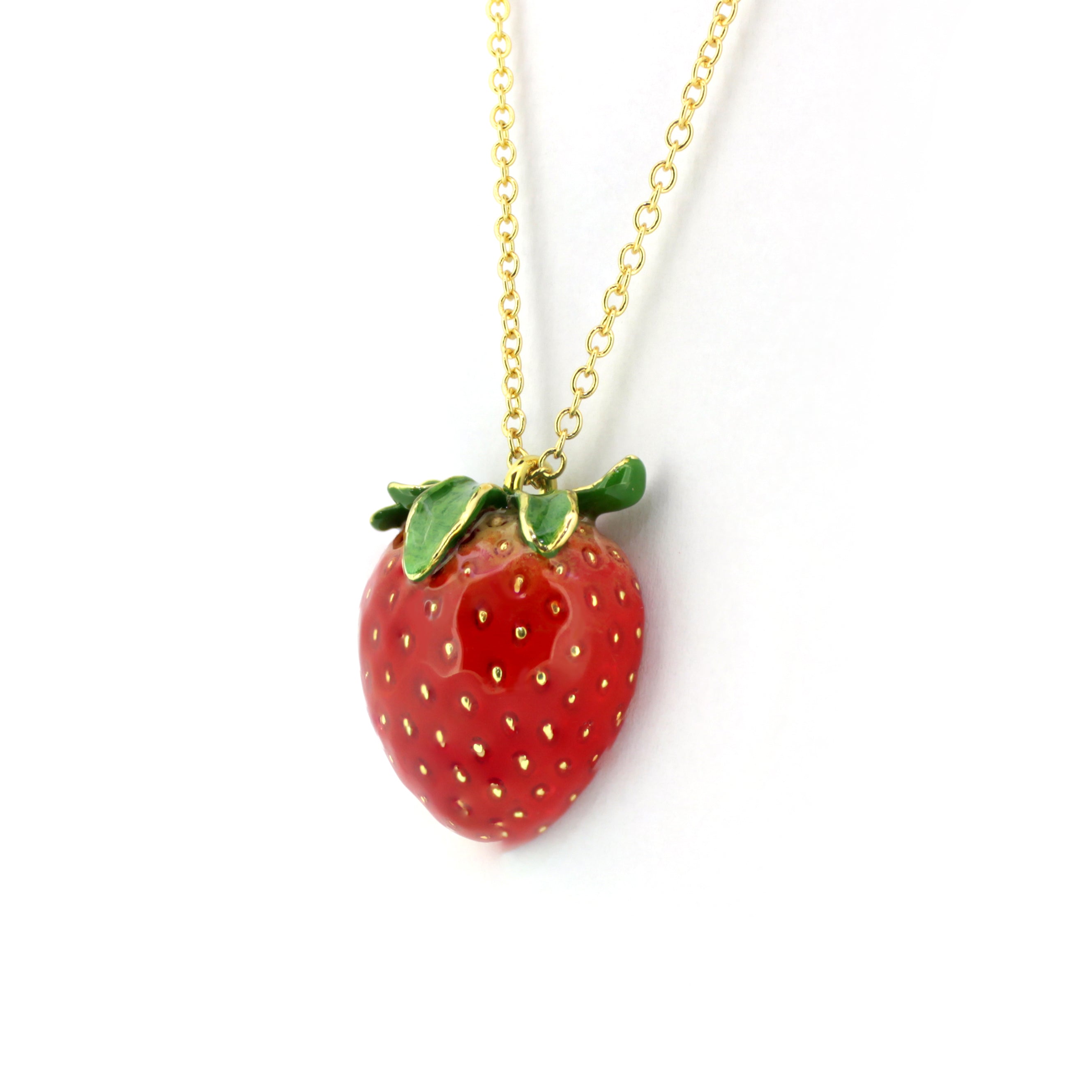 Beautifully crafted red strawberry pendant with a gold chain necklace, inspired by nature.