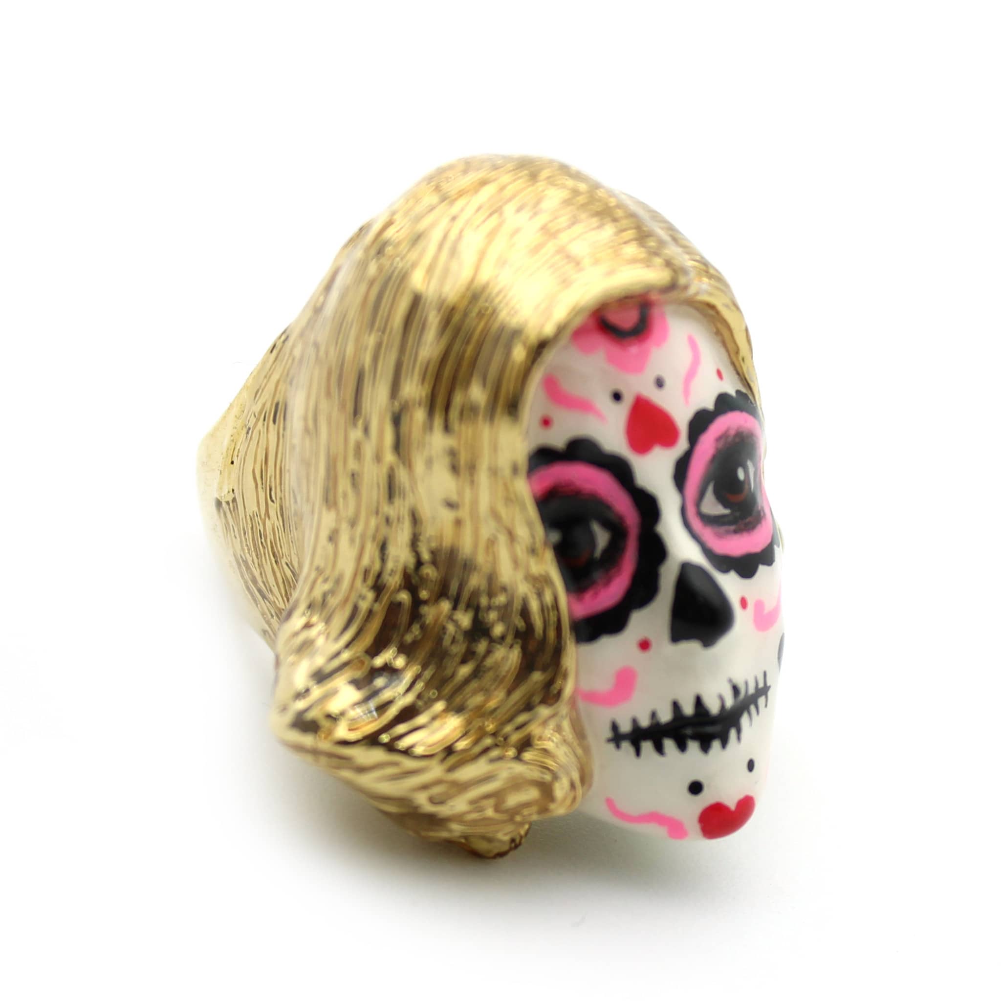 Beautiful hand-painted ring featuring a mask with a skull motif, a blonde wig, vibrant pink and black face paint, and heart-shaped patterns.