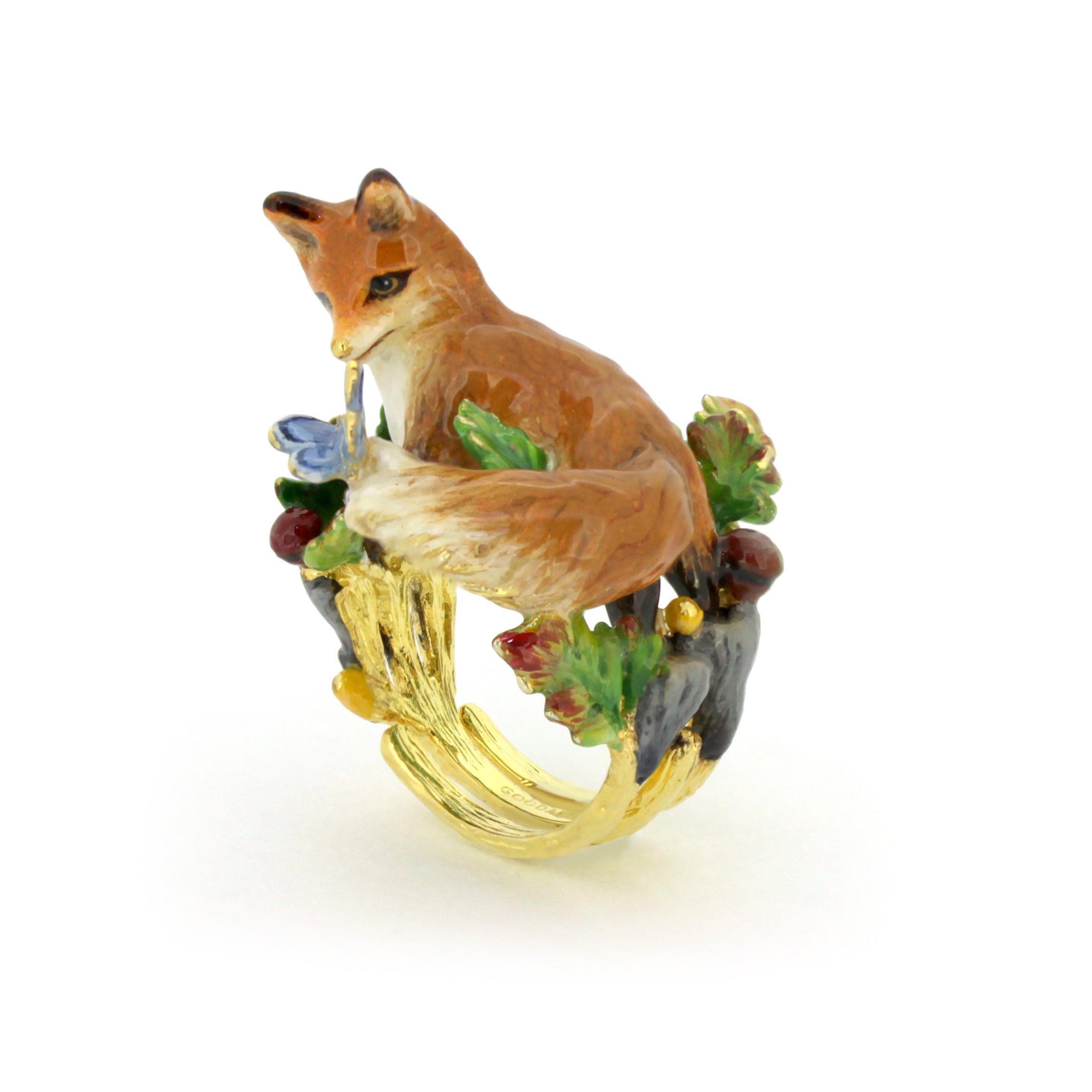 A beautifully crafted gold ring featuring a fox and a butterfly, adorned with colorful enamel details.