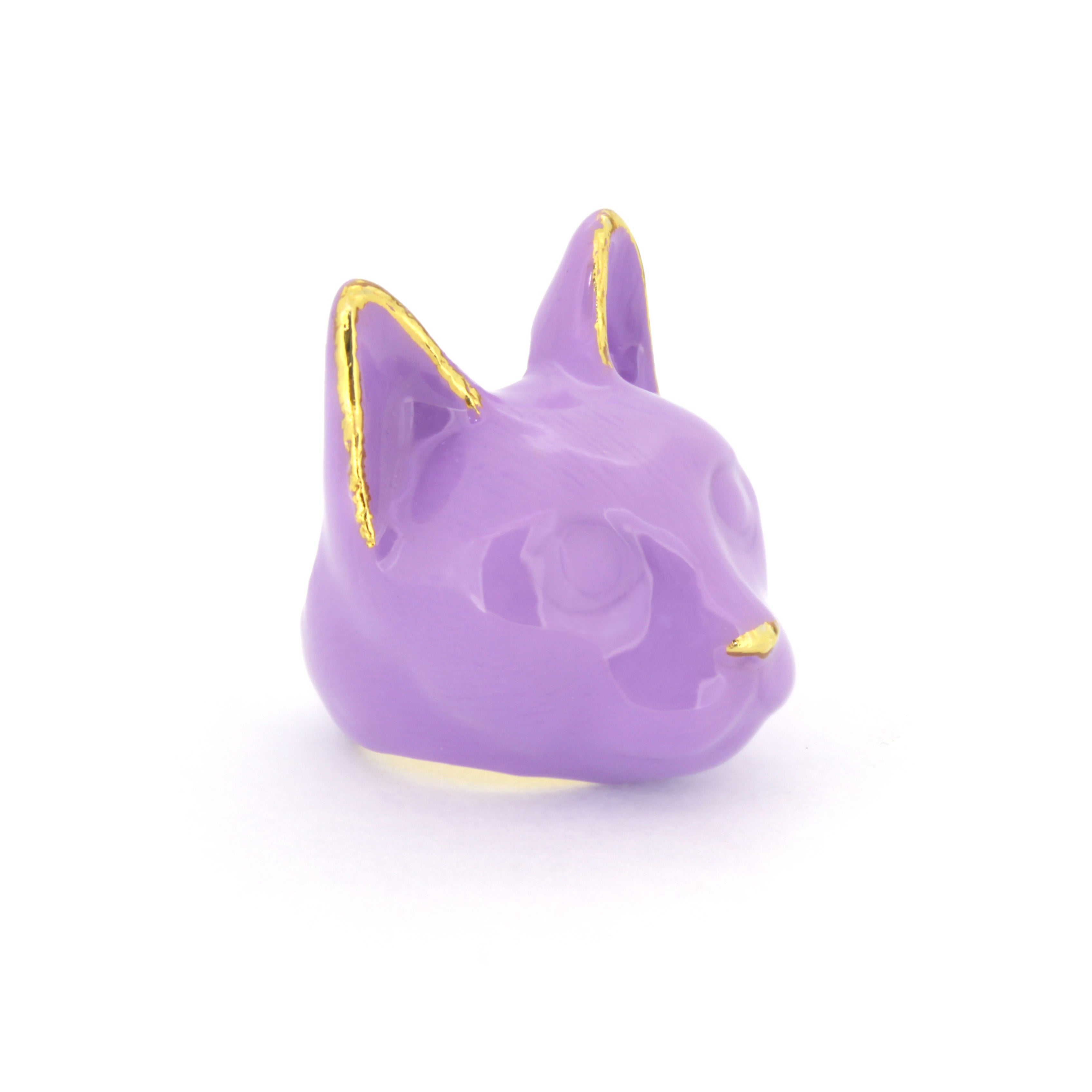 A purple cat face ring with gold accents on the ears and a small gold nose, perfect for cat lovers