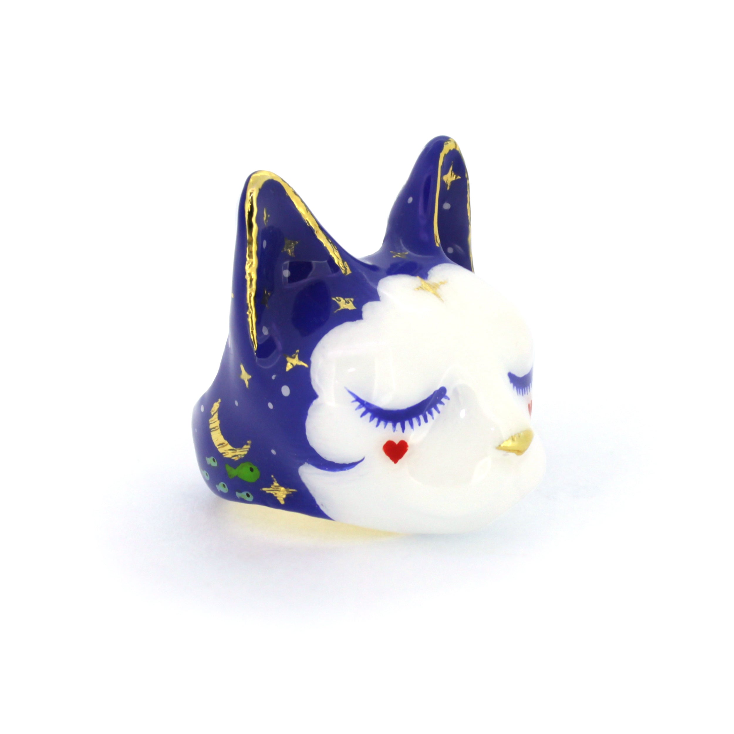 A cute sleepy cat ring with a dreamy expression and colorful design.