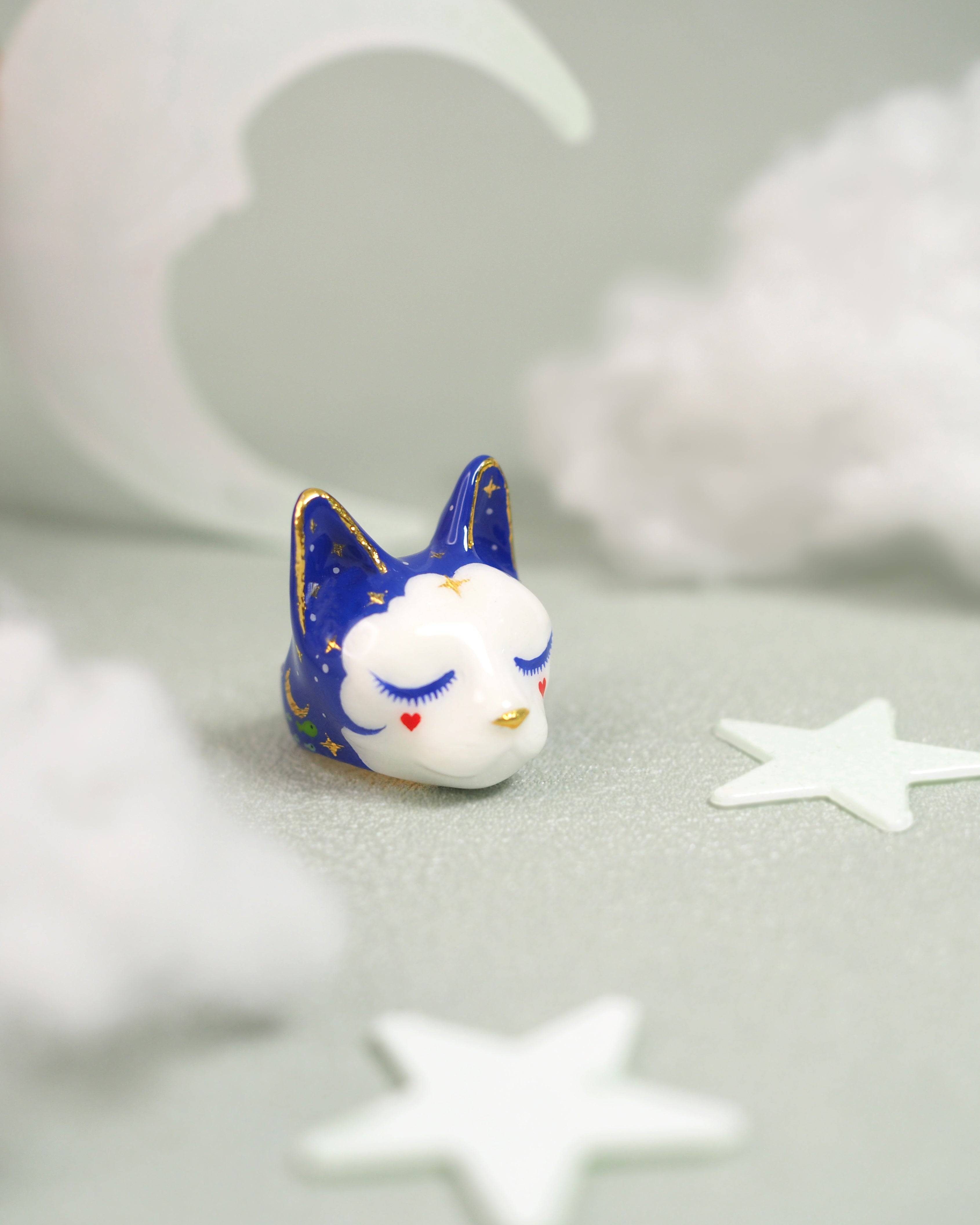 A charming ring of a dreaming cat with closed eyes and a whimsical design, perfect for cat lovers.