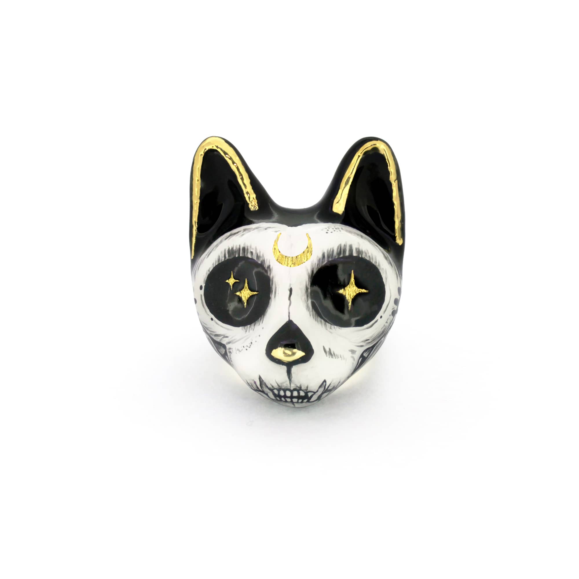 An artistic cat ring designed with a skull motif, featuring black and white colors with gold accents and starry eyes.