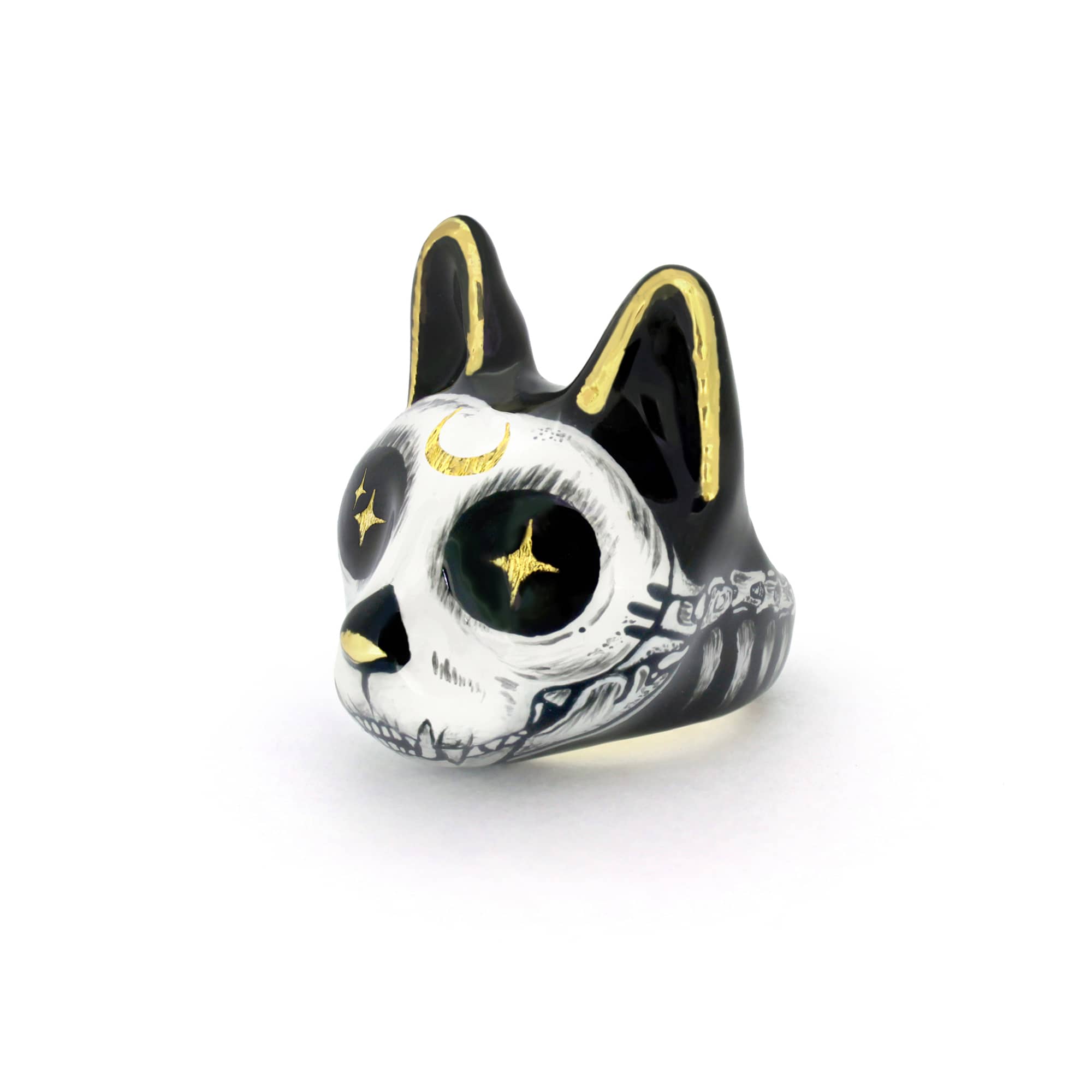 Black and white cat ring featuring a skull design with gold accents and starry eyes, ideal for Halloween costume.