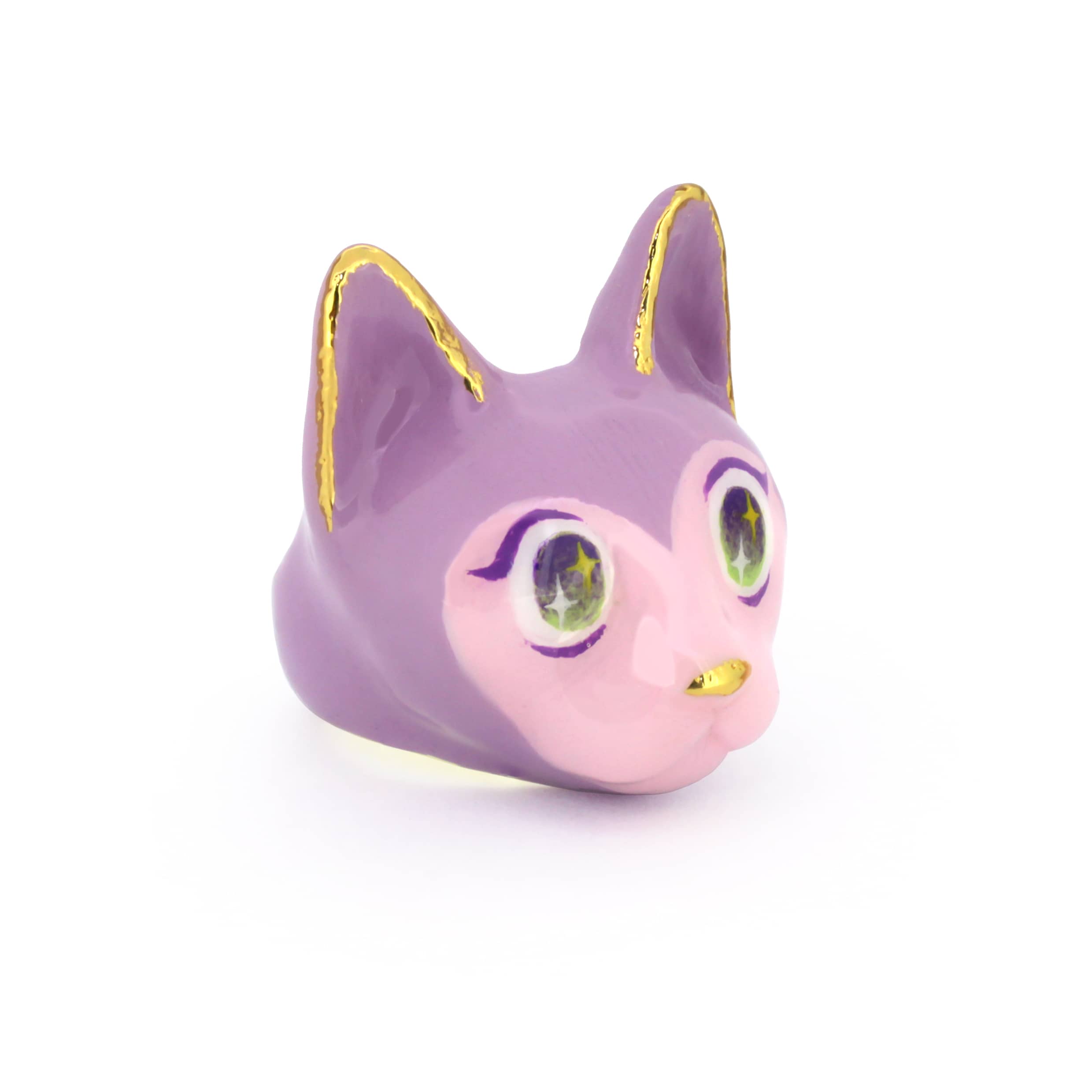 A whimsical cat head ring featuring purple and pink tones, with charming large eyes.