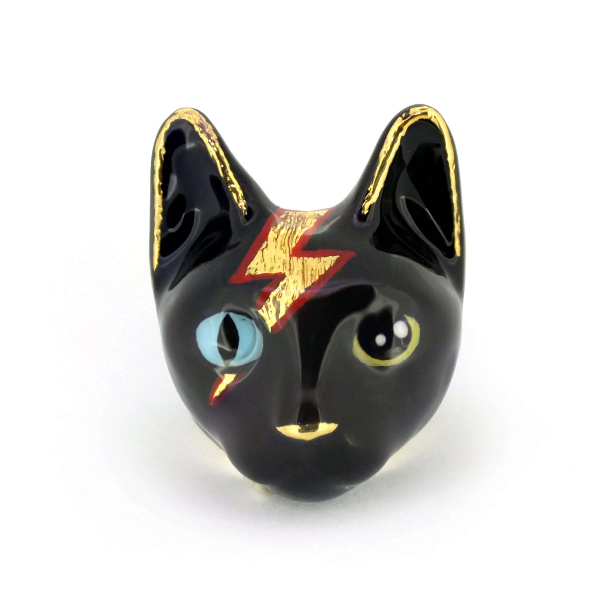 A playful black cat ring with blue and yellow eyes and a lightning bolt design.