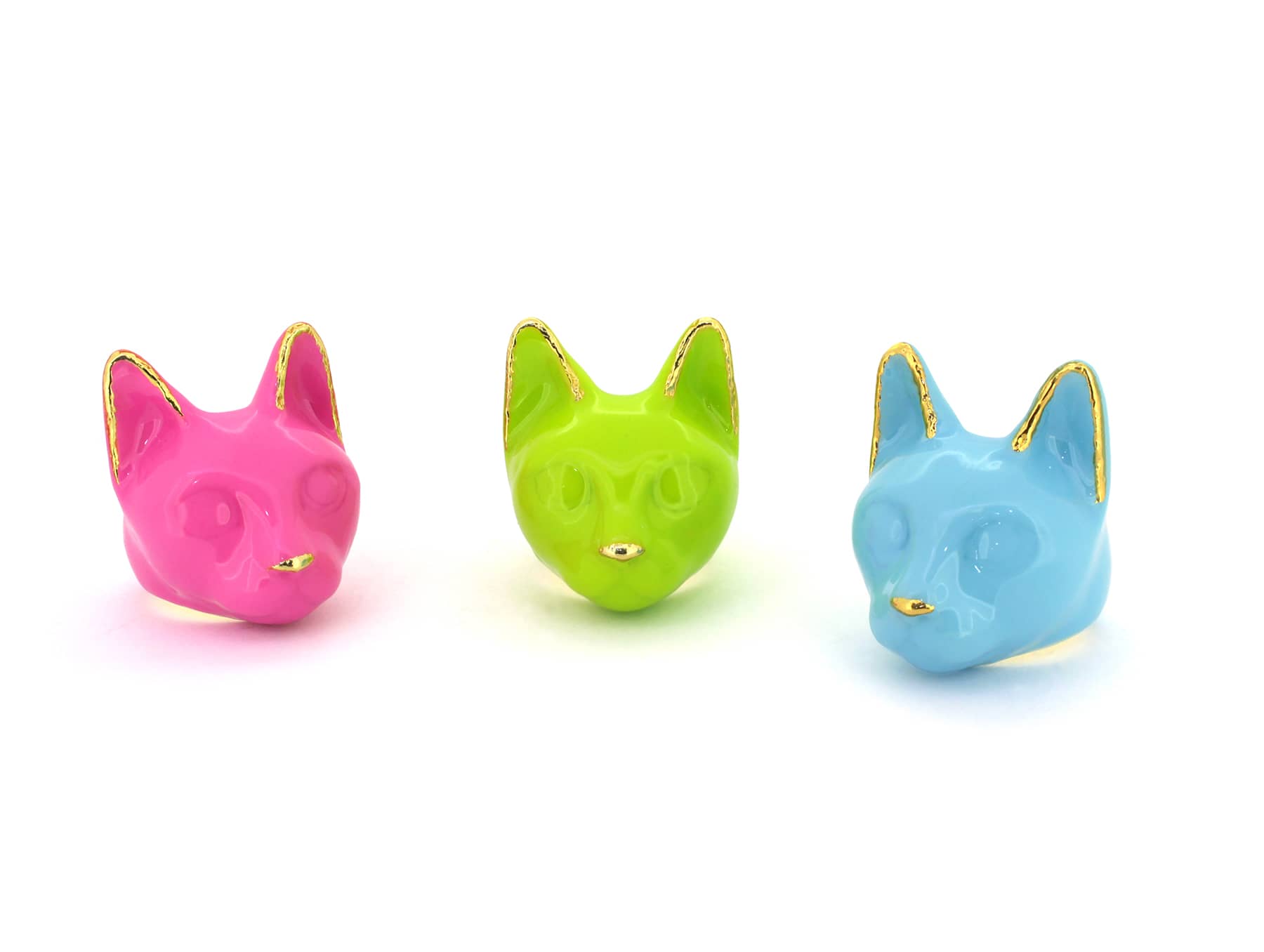 Three colorful trendy cat's head rings in pink, green, and blue, perfect for cat lovers.