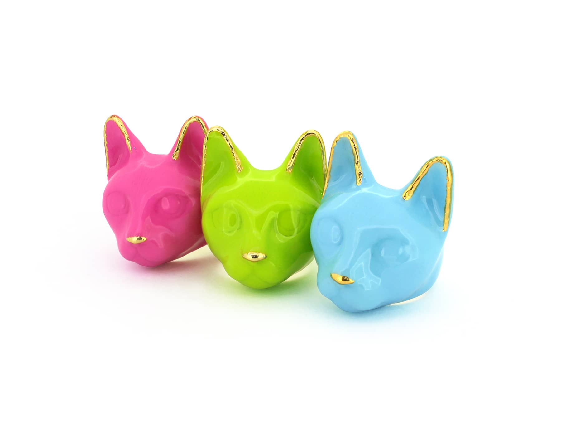 Three colorful trendy cat's head rings in pink, green, and blue, perfect for cat lovers.