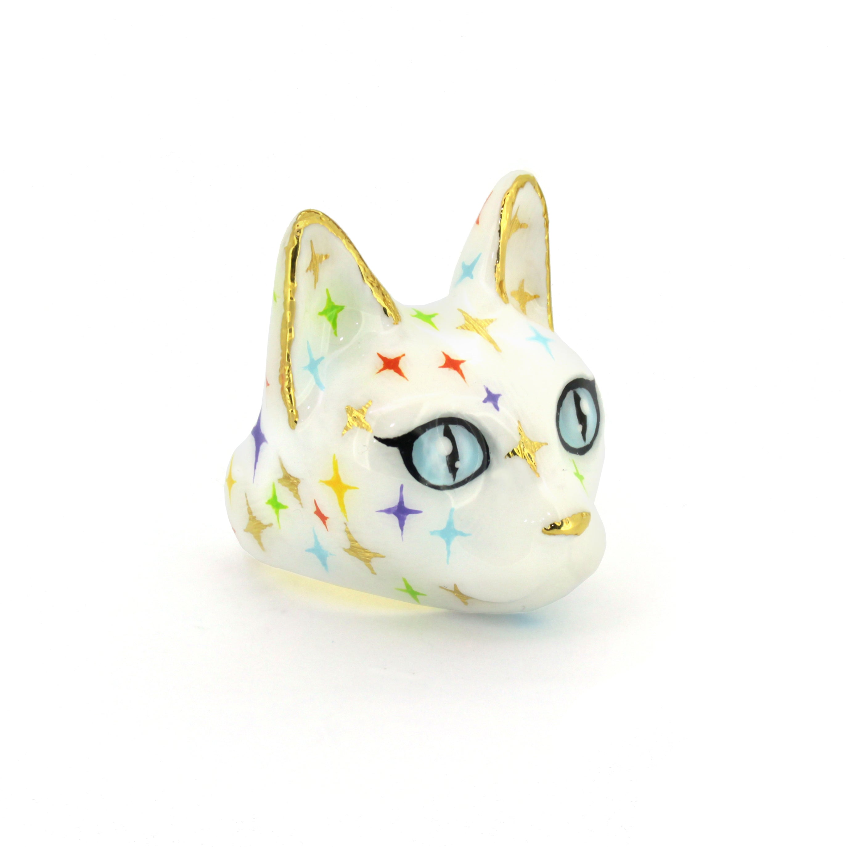 White cat head ring in white with blue eyes featuring multicolored twinkle patterns, perfect for cat lovers.