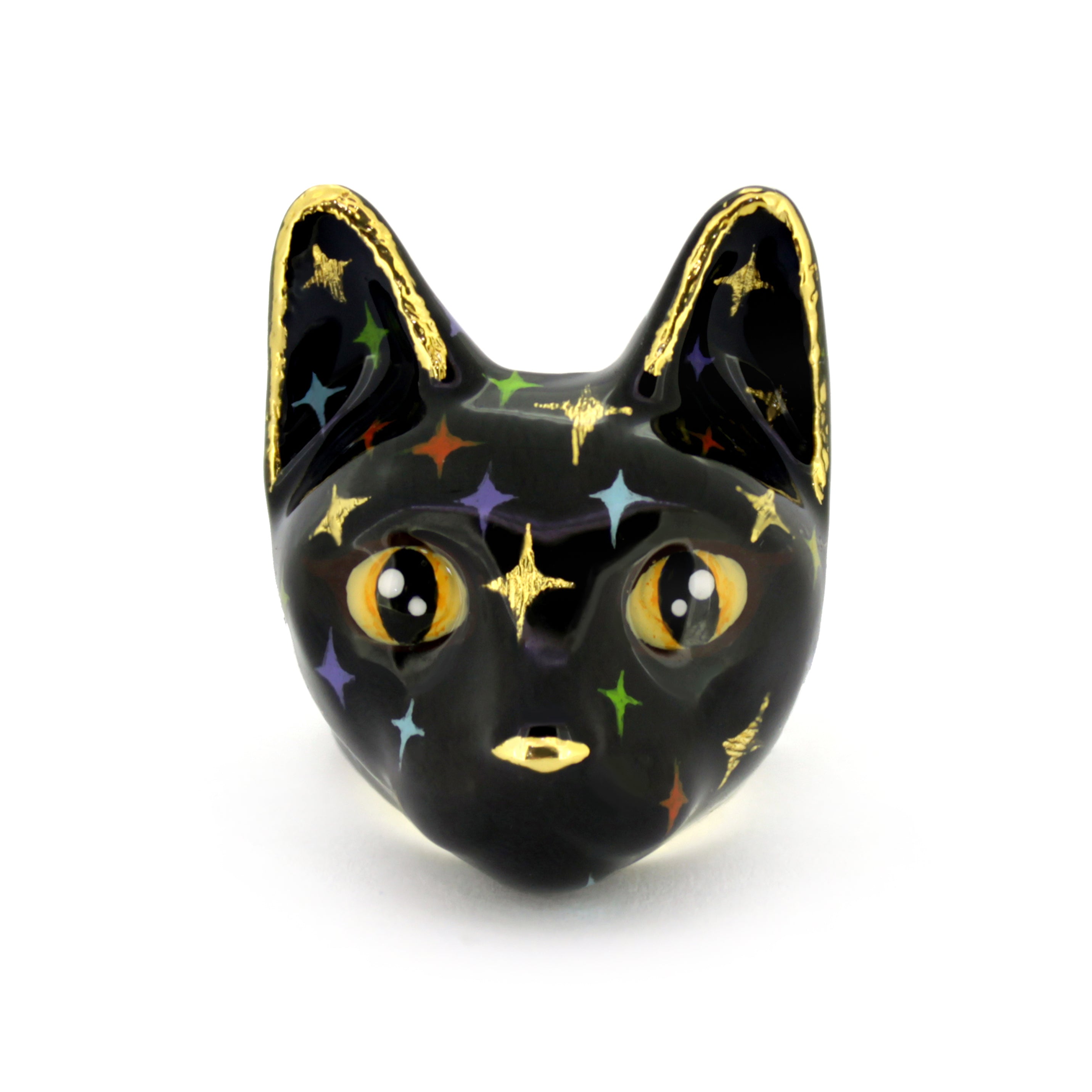 Black cat head ring with blue eyes and gold accents, featuring multicolored twinkle-shape details.