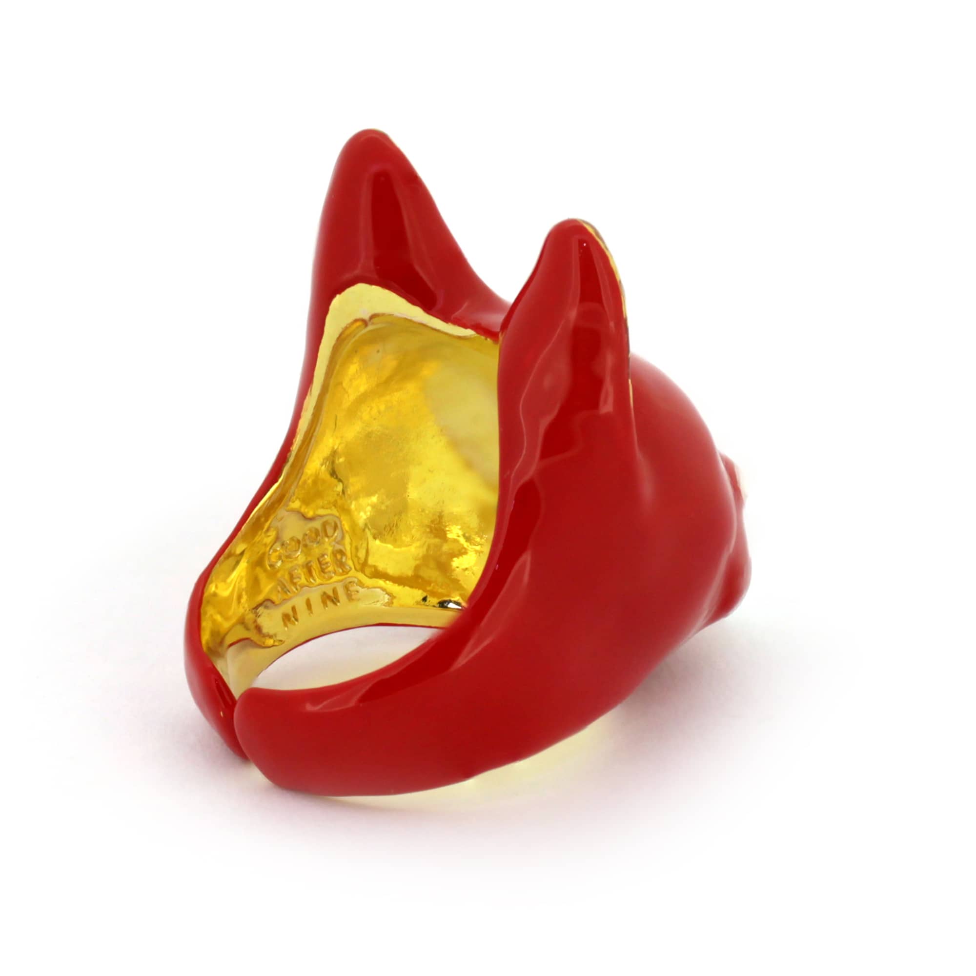 A red cat ring with a small white heart-shaped nose, perfect for animal lovers.