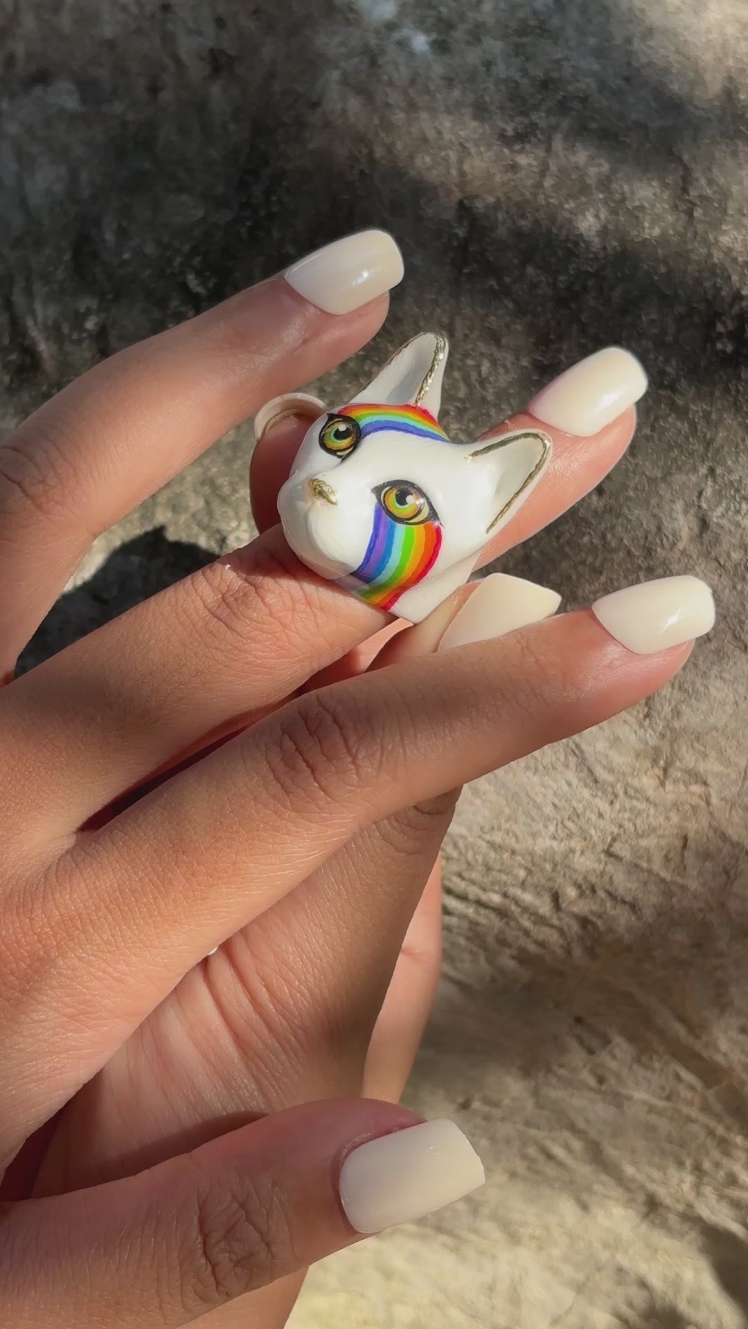 Collection of unique  cat rings showcasing designs on fingers, perfect for cat lovers.