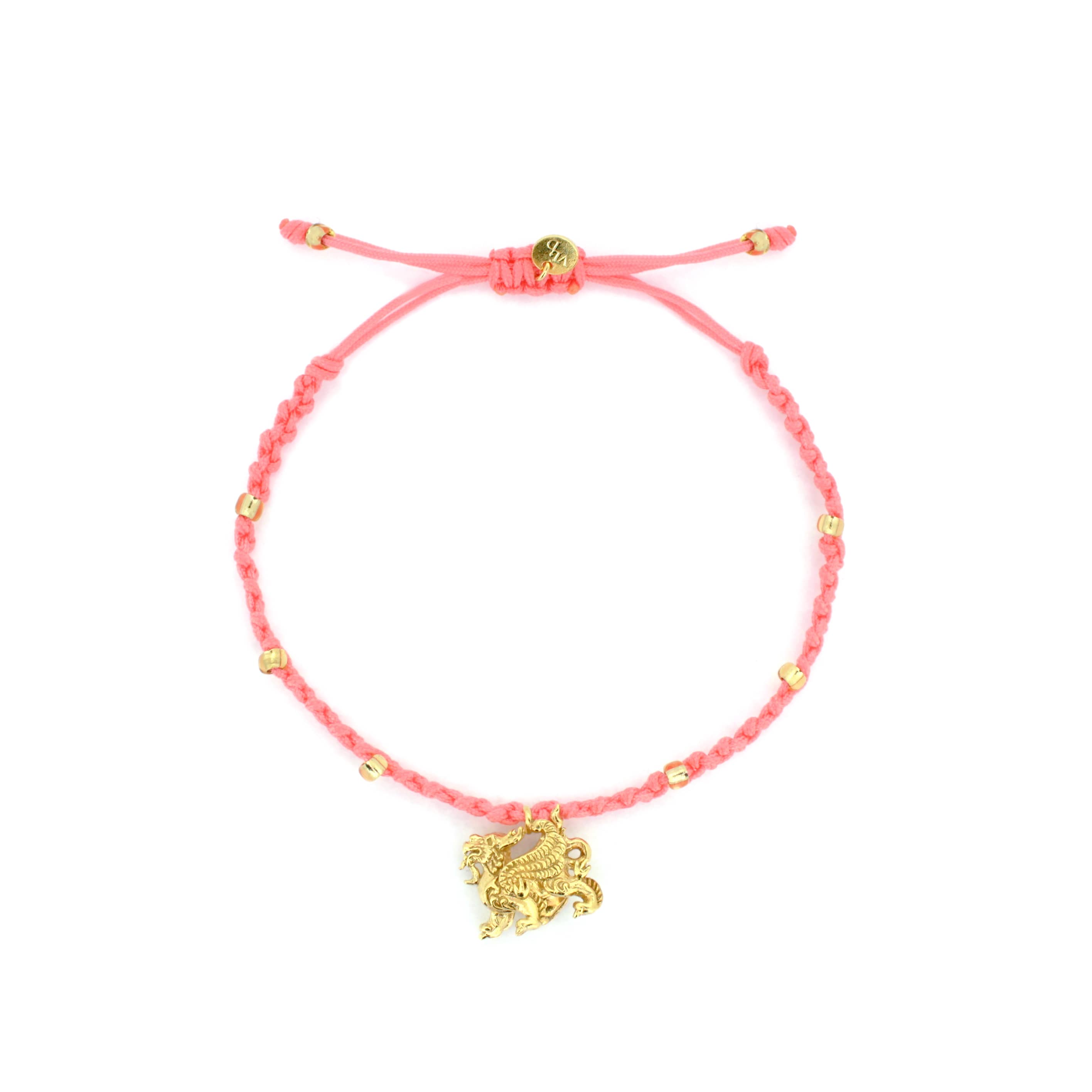 A pink bracelet with a gold Pixiu charm