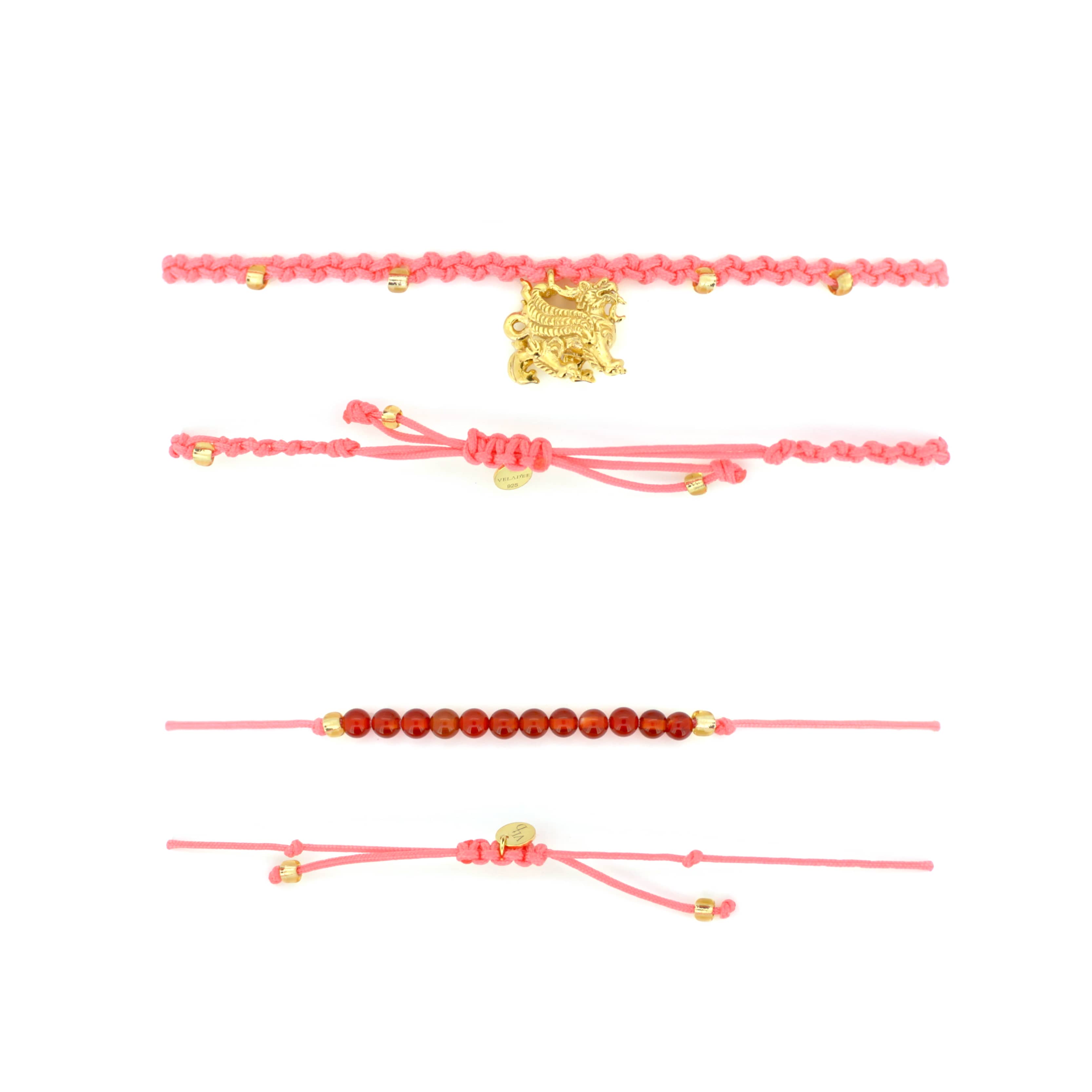 Set of two pink bracelets: one with a gold Pixiu charm, the other with  red agate-round beads.