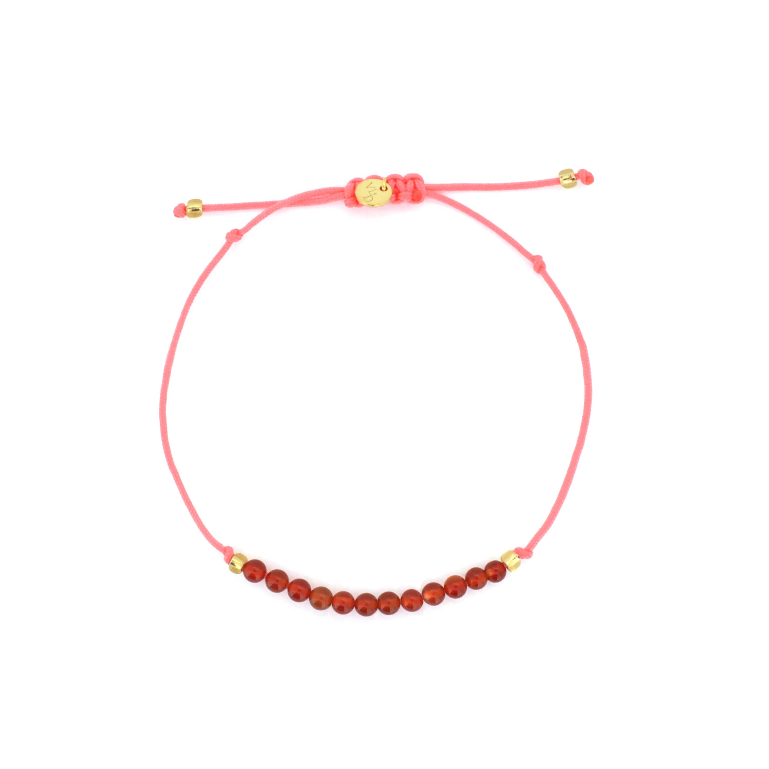 A pink bracelet with  red agate-round beads.