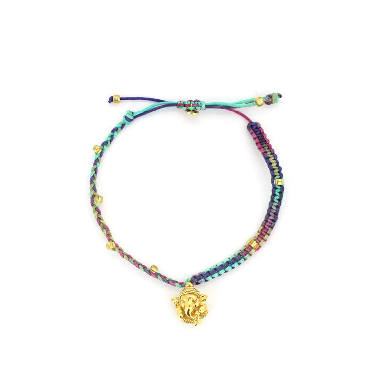 Spiritual accessory featuring a Ganesh charm on a braided bracelet