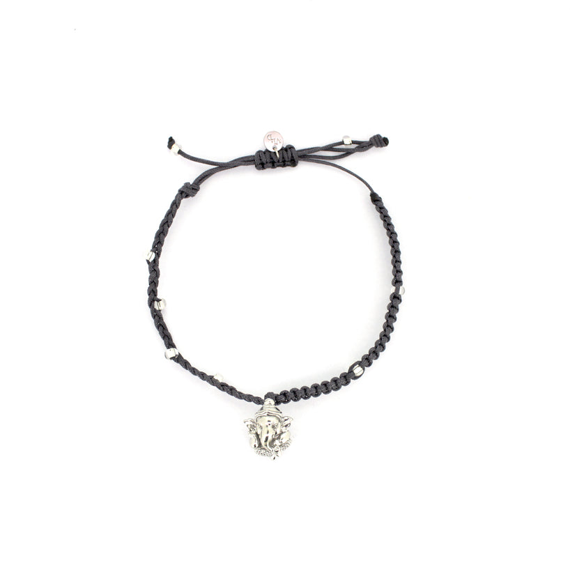 Silver Ganesh charm on a braided black bracelet