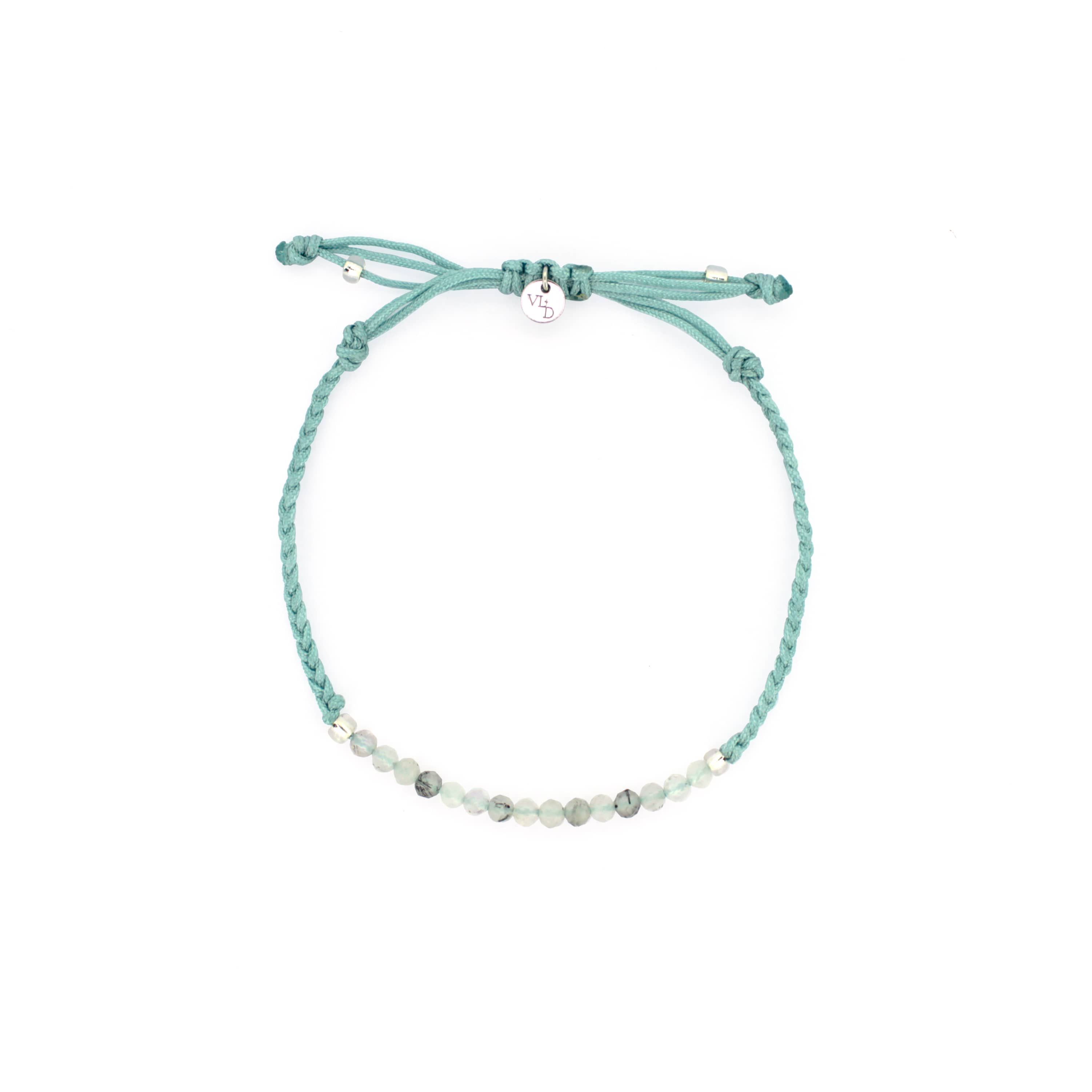 A light blue bracelet with grey quartz-faced beads.