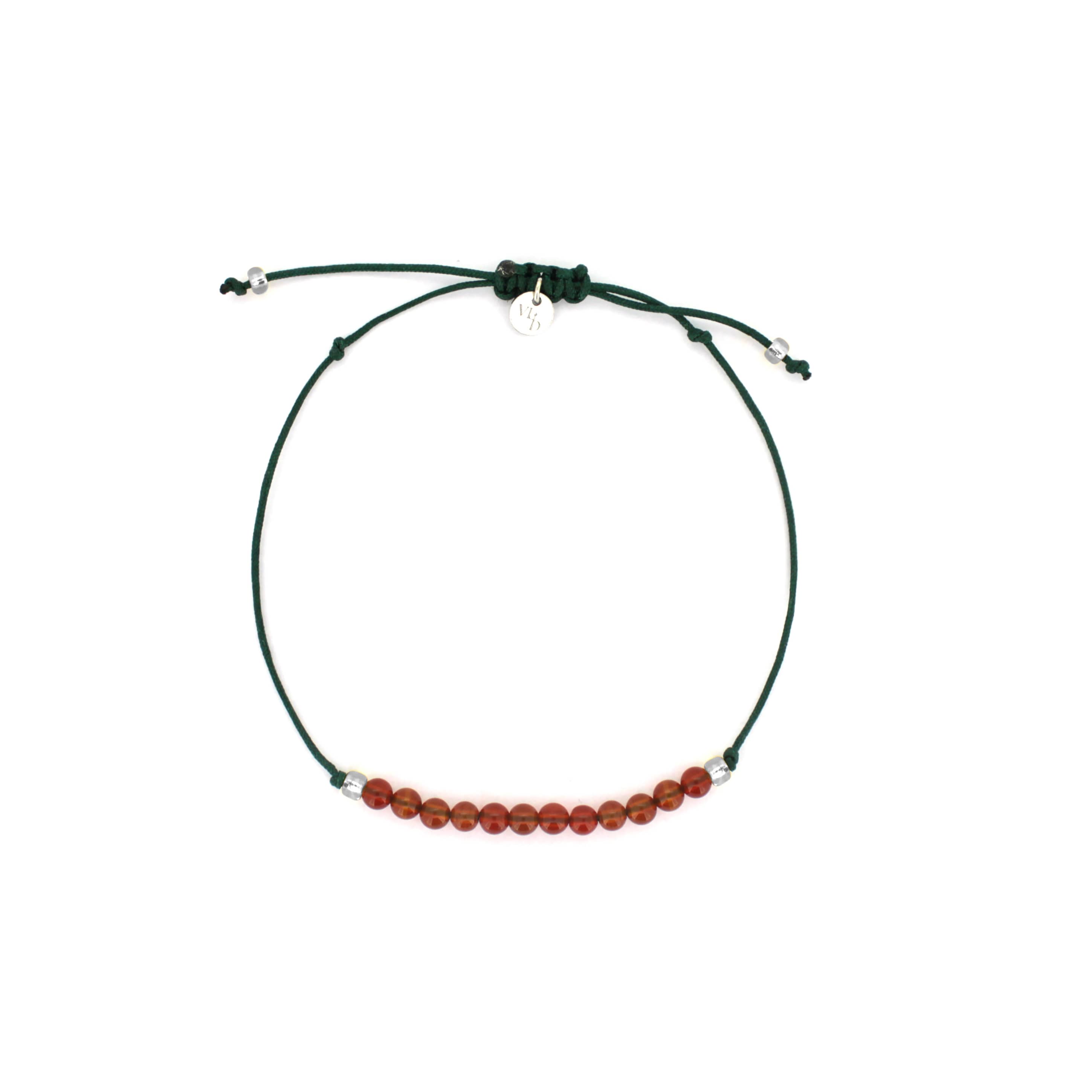 A green bracelet with  red agate-round beads