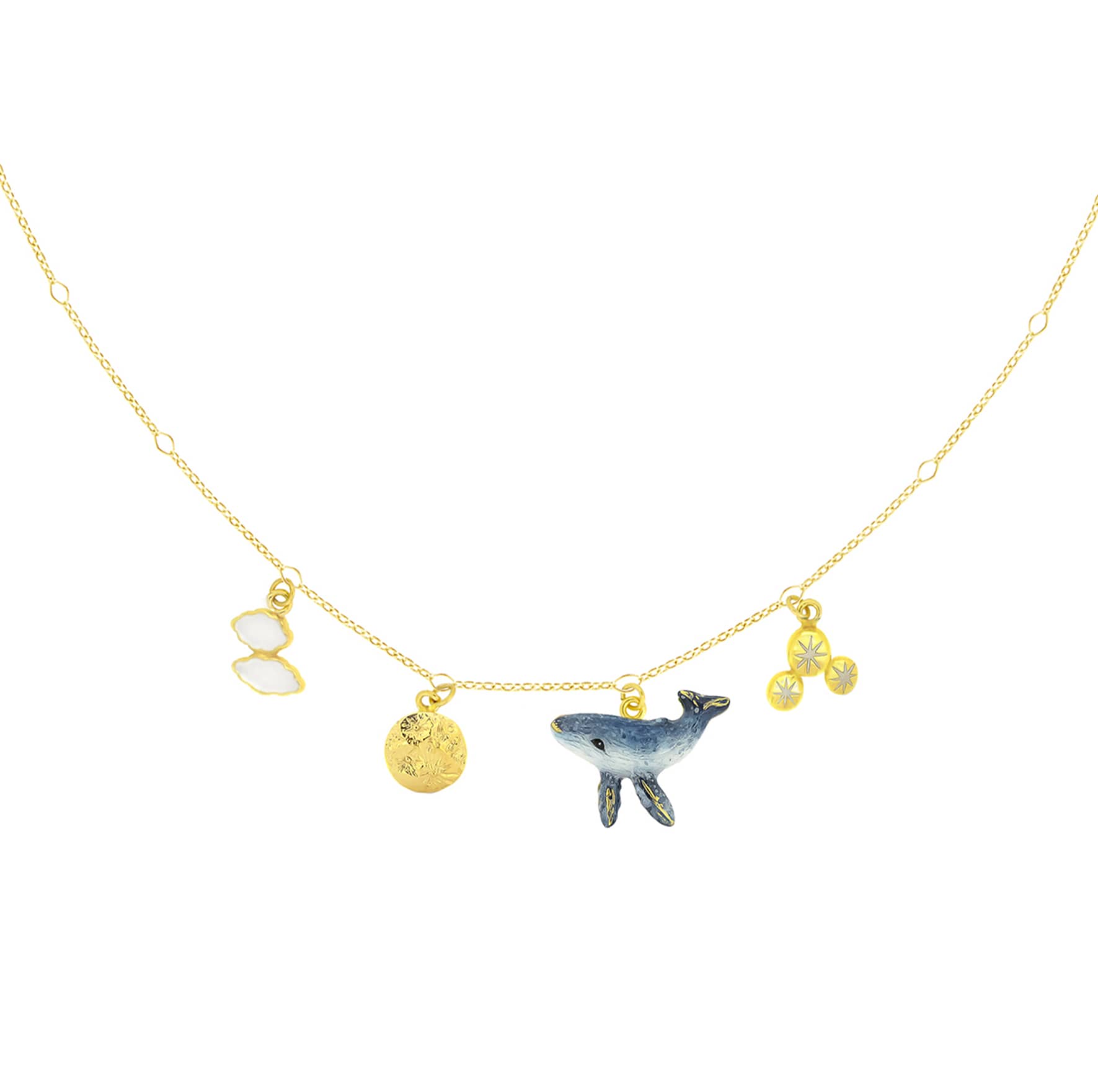 Whimsical charm necklace featuring a whale, a moon, clouds, and stars.