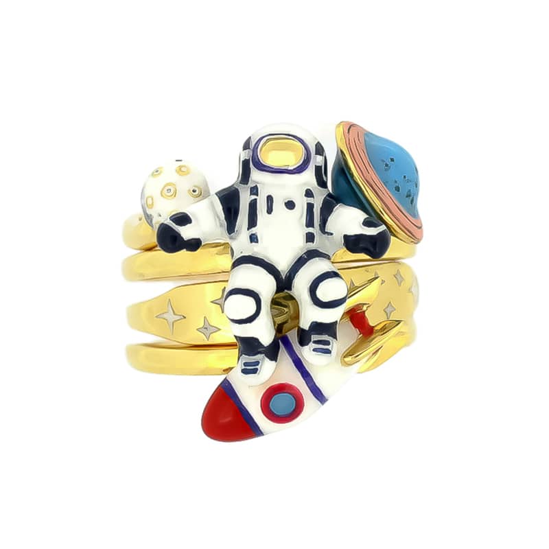 Whimsical space-themed stacking ring set featuring planets, an astronaut, a rocket, and a star design.