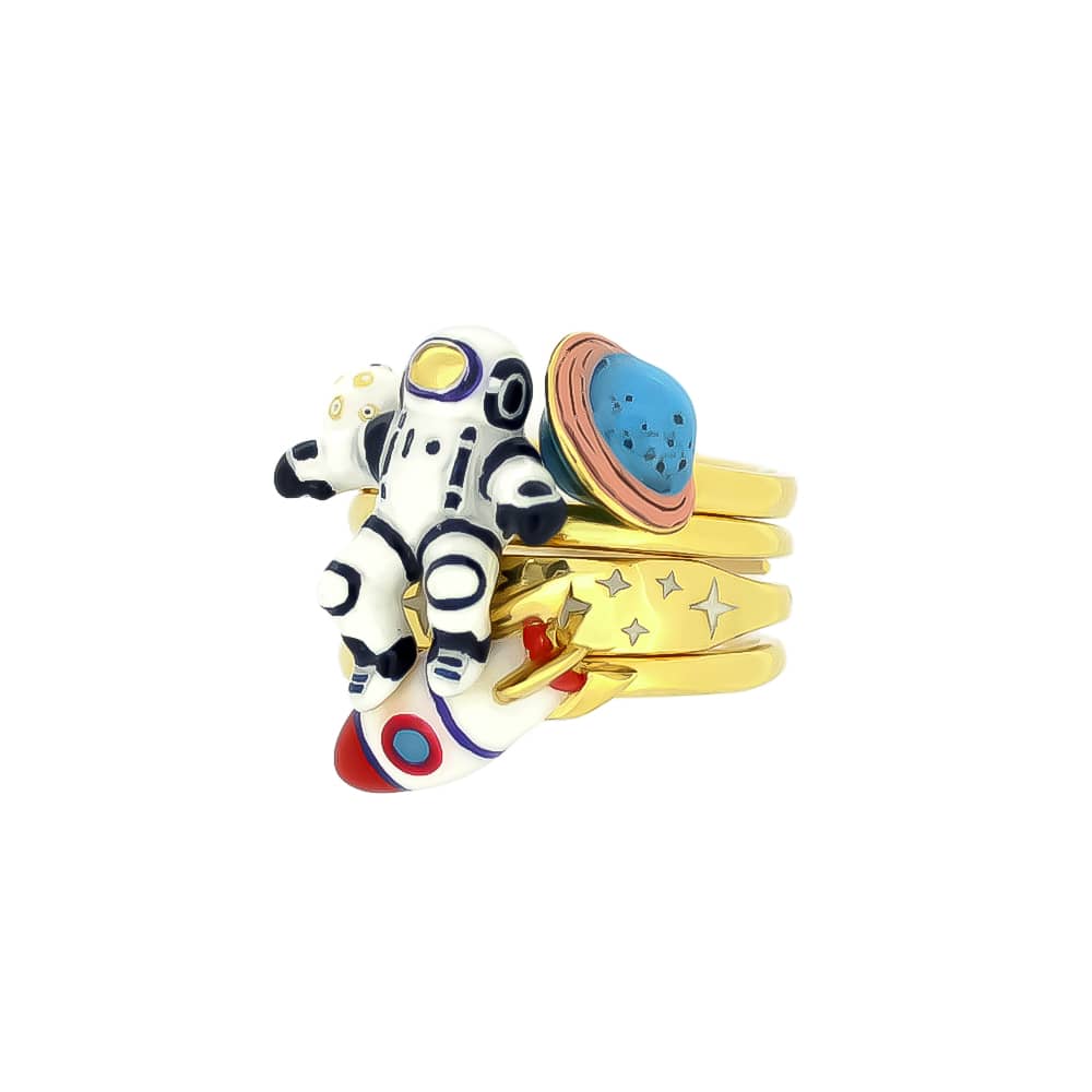 Space-themed stacking ring featuring planets, an astronaut, a rocket, and a star design.