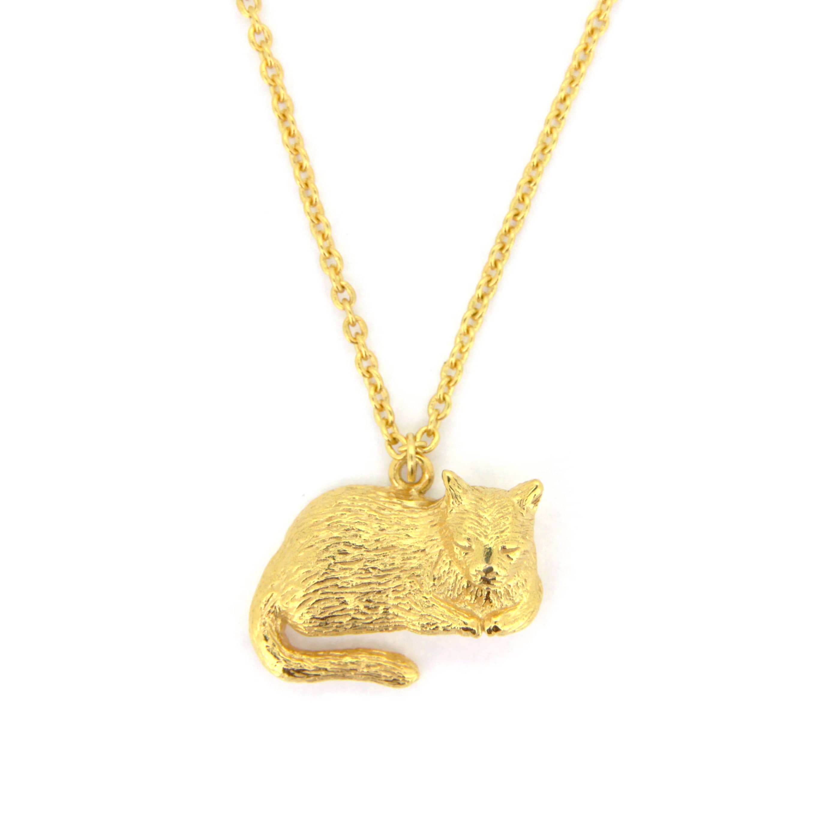 Charming gold pendant necklace featuring a sleeping cat design.