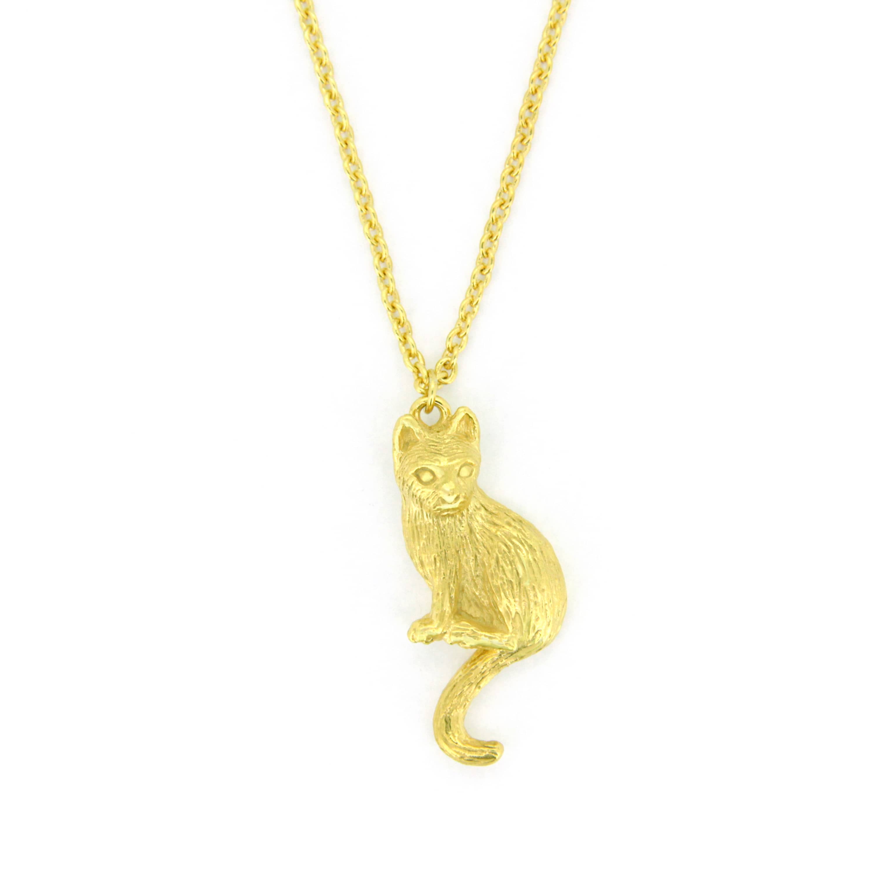 Gold pendant necklace featuring a setting cat design.