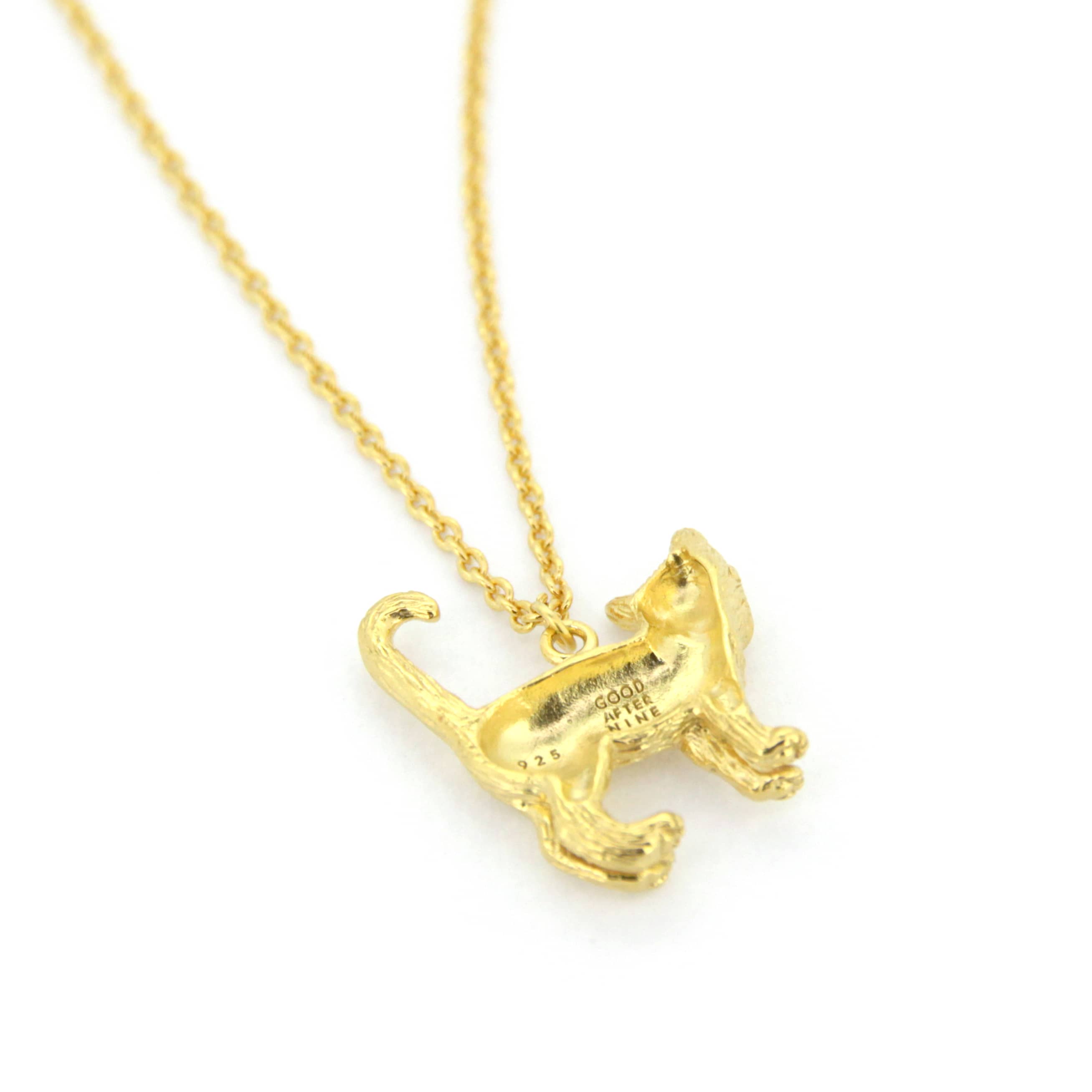 A whimsical gold pendant necklace featuring standing cat design with detailed fur texture.