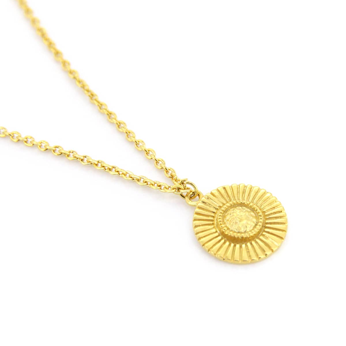 Gold necklace with a circular pendant with a moonshine design