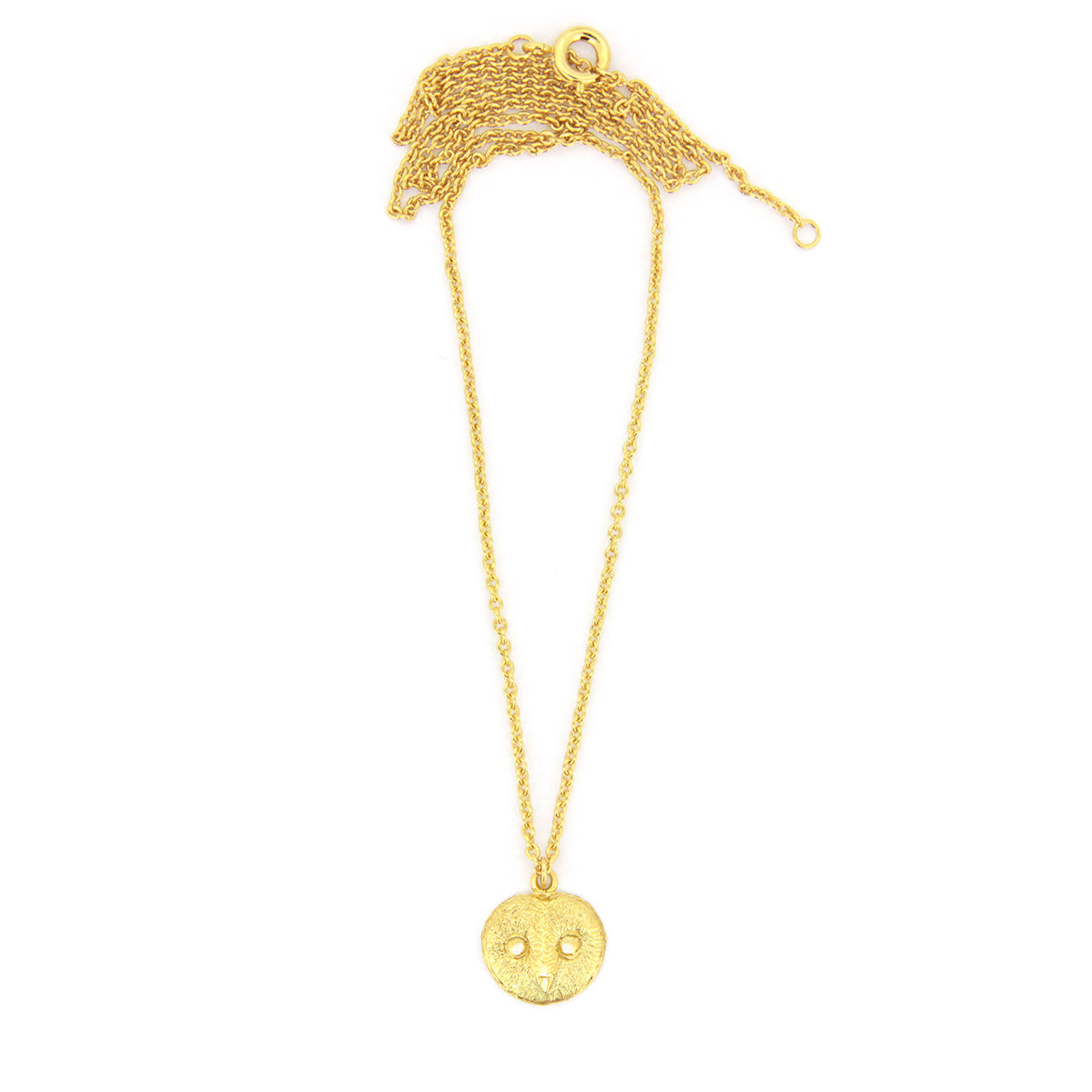 Gold necklace featuring a beautiful pendant with an owl face design