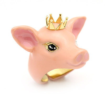 Cute pig ring with a golden crown, perfect for jewelry lovers.