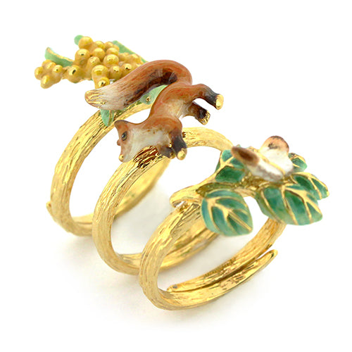 Nature-inspired stacking ring set featuring a fox, butterfly, and flower.